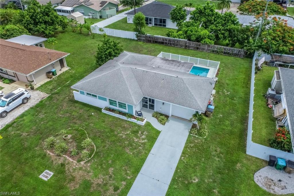 Tremendous value and move-in ready HEATED POOL home!  Welcome into the perfect Cape Coral retreat with fresh paint, IMPACT WINDOWS, and tile flooring throughout.  Step outside to your screened-in lanai that leads right out into your fenced-in pool.  NEVER FLOODED and ALL ASSESSMENTS PAID!  Kitchen includes replaced cabinets, updated appliances, and a slick tile backsplash.  Plantation shutters on both living area and primary bedroom windows.  Enjoy the benefits of a whole house water filtration system and additional Eco-wool attic insulation rated to R-40, making this home both efficient and practical.  NEW washer and dryer!  Backyard space perfect for entertaining and pets.  NO CARPET!  Property equipped with an auto sprinkler system.  TRANSFERABLE FLOOD POLICY only $2,338 a year!  Phenomenal location just minutes from Downtown Cape Coral, restaurants, entertainment, and much more.  Come discover what the simple Southwest Florida lifestyle feels like.  Easy to show and easy to close.  Call today!