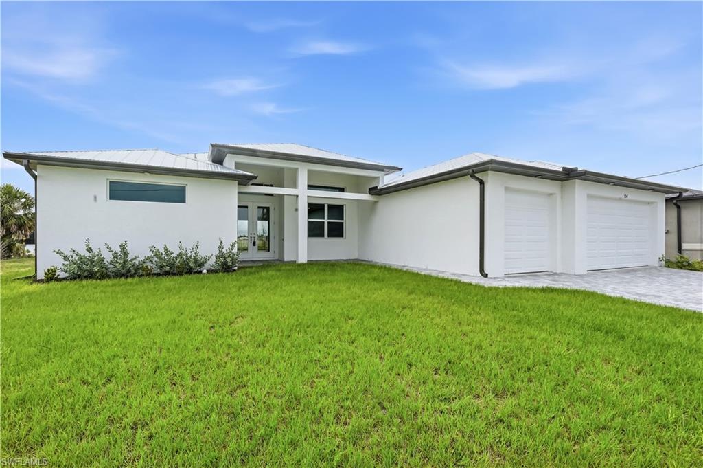 Indulge in the ultimate waterfront lifestyle with this masterfully crafted 4-bedroom, 3.5-bathroom custom estate completed in 2026. Situated on an expansive, picturesque lot, this architectural masterpiece offers rapid, unrestricted Gulf access that places the white sands of Sanibel Island just a breathtaking 20-minute boat ride from this gulf access home. Facing West, enjoy the beautiful cotton candy sunset sky nightly!  Built to the highest modern standards, crowned with a sleek metal roof, brand new sea-wall and featuring a large attached 3-car garage!  The storage is plentiful and the garage space is perfect for vehicle and water toy storage, the residence showcases meticulous craftsmanship where absolutely no detail has been overlooked. The ceilings are soaring, the bedrooms are large and it is almost 2500 sqft under truss.  This property serves as your private gateway to Southwest Florida, a true tropical paradise celebrated worldwide for its crystal-clear waters, world-class fishing, and pristine, sun-drenched beaches. The heart of the home features a state-of-the-art chef’s sanctuary outfitted with premium, high-end finishes designed for flawless entertaining. The sophisticated floor plan is highlighted by two palatial master suites, with the secondary master suite specifically engineered with direct pool bath access for effortless indoor-outdoor living. The primary master oasis serves as a jaw-dropping visual centerpiece designed to turn heads.  Easy living in a prime part of town!  Easy and a joy to show!
