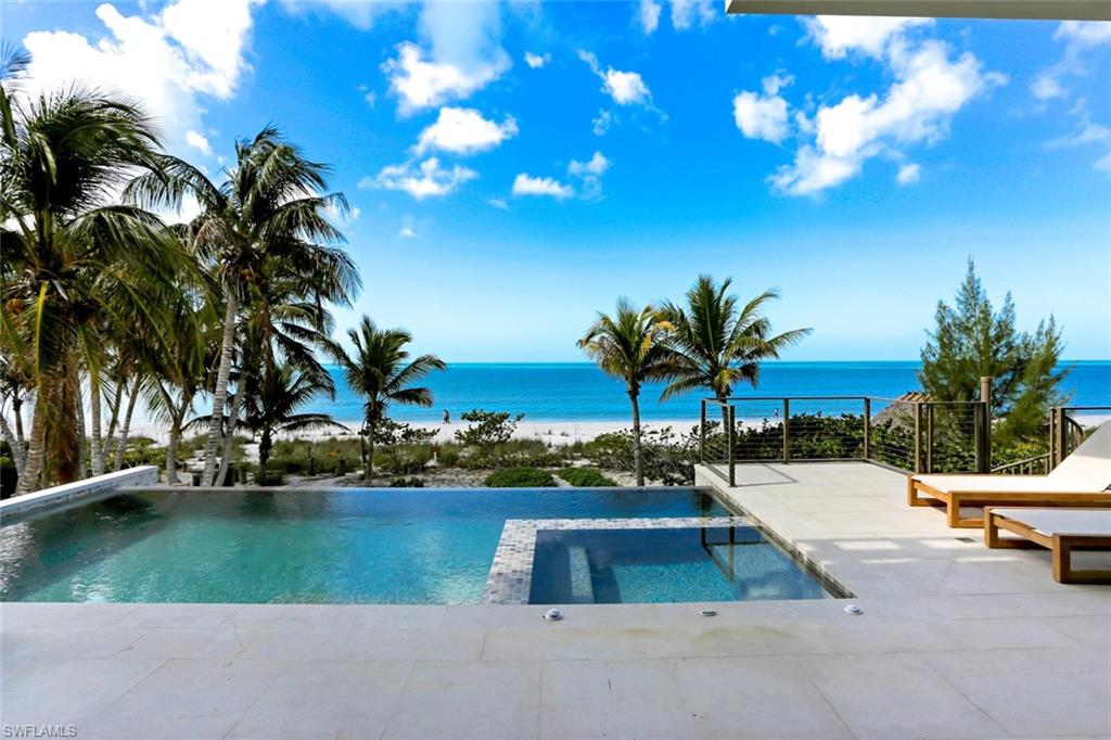 RARELY AVAILABLE: Direct Beachfront, State-of-the-Art, “Potter Homes” NEW CONSTRUCTION expected for completion January 2021. This coastal contemporary, modern masterpiece has an open floor plan featuring fully pocketing sliders leading to the elevated entertainment deck with infinity pool/spa, outdoor kitchen & fireplace, all overlooking the Gulf of Mexico. Chef’s kitchen features Thermador appliances, stone counters & custom wet bar, perfect for entertaining. Smart-Home technology includes surround sound, automated lighting system, motorized shutters/screens & private elevator. Furnished & professionally designed by celebrated Freestyle Interiors. This spacious custom home features over 5,200 sq ft of living space with dual master suites, 6 total bedrooms, dual laundries & 4+ car garage with bonus space. Built to the newest & most stringent codes by award-winning Potter Homes with concrete block construction & all impact doors/windows. Located minutes to Mercato & North Naples’ amenities, easy access to I75 & the International Airport. This Gulf-front residence encompasses the best of the best; all overlooking the stunning Gulf of Mexico with the sugar sand beach as your backyard.