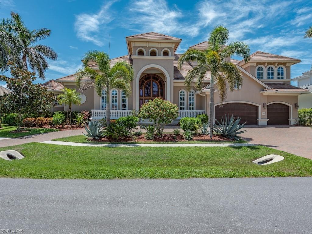 Luxurious custom residence in the scenic Collier Bay neighborhood with fast, water direct access (no bridges) to the Gulf by boat.  Offering 6,250 interior square feet, this elegant estate has everything you’d expect: thoughtfully designed living spaces, 6 luxurious bedrooms plus a private study, 7 baths, high-end finishes including marble travertine flooring, custom built-ins, gas fireplaces & designed with an exceptional indoor-outdoor flow.  Catering perfectly to boaters and entertainers alike with a resort-style pool & spa and loads of upgrades.  The gourmet kitchen is outfitted with shaker-style cabinetry, granite countertops, a wet bar, large island, and walk-in pantry, premium appliances include a six-burner gas cooktop with pot filler, wall oven, microwave, paneled French door refrigerator, dishwasher, and wine fridge. The adjacent dining area features pool views, plantation shutters, and easy lanai access.  There are two living rooms, one with floor-to-ceiling windows to enjoy the natural light, plus an upstairs media room offer generous spaces for relaxation. The formal dining room is accessed through French doors, the luxurious owner’s suite features a bay window overlooking the pool and canal, sitting areas, large walk-in closets with built-ins, and a spa-like bath with quartz vanity, natural onyx tile, dual sinks, a spacious walk-in shower with multiple heads, and soaking tub.  All guest suites include ensuite baths with frameless walk-in showers.  There are two laundry areas and the guest suites upstairs have private balconies and there is even a 3rd level loft suite with balconies & bay views. For boating enthusiasts, the dual dock includes a 56,000-pound boat lift, dual jet ski lift, and a fish cleaning station. Enjoy sunny SE exposure, impact glass windows, electric shutters, & a spacious 3-car air-conditioned garage.  Outdoor living is unparalleled with multiple balconies, a screened lanai, and a covered entertainment area complete with a summer kitchen, bar, grill, & refrigerator.  The heated pool with waterfall spa is complemented by a convenient pool bath & the elevator provides seamless access to all three levels.  This exceptional estate blends luxury, comfort, and coastal living, offering the ultimate island lifestyle next to scenic Collier Bay & is just around the corner from the sugar sand at Tigertail Beach!