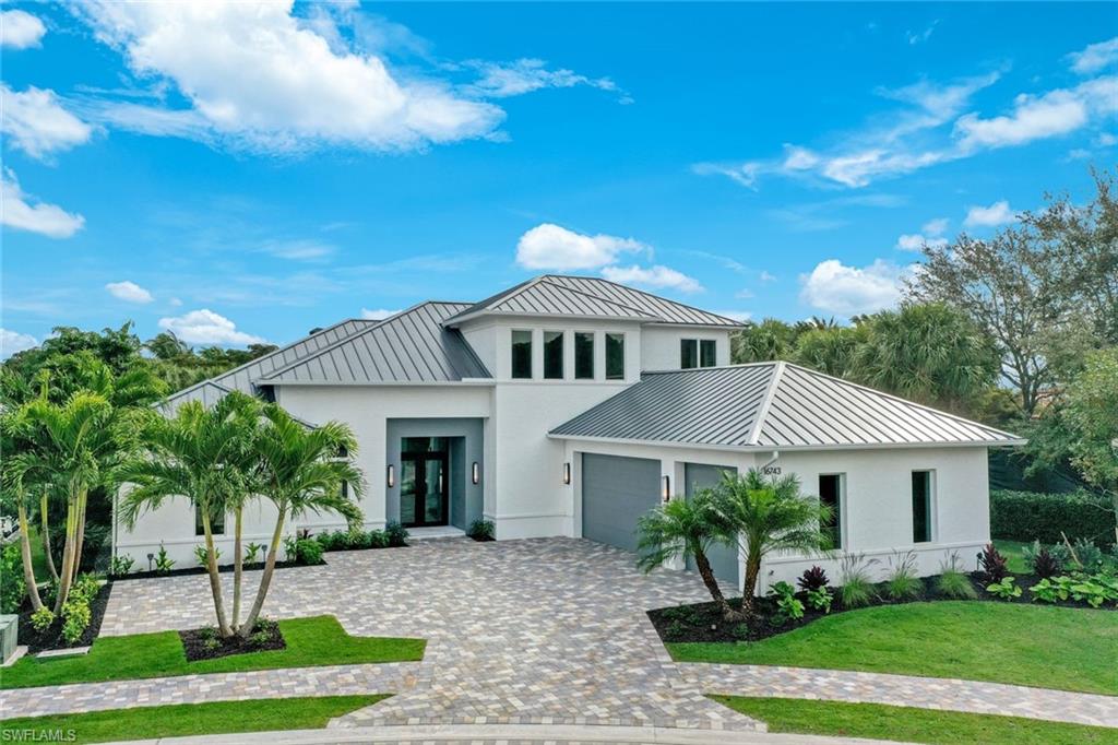 H13666 New construction, completion 2024. The Sanctuary is a 4-bedroom, den, and loft home with 4 bathrooms plus 2 half-baths. Built by Distinctive Communities in the gated North Naples community of The Enclave of Distinction. Within this private boutique neighborhood of 27 homes, the Sanctuary is situated on a beautiful private homesite with garden view. This 4,291-living area home boasts views as soon as you walk through the door, through the great room, to the resort-style pool with lap lane for the fitness enthusiast, outdoor cook center and fire pit. The gourmet-inspired kitchen features Monogram & Café appliances, custom wood cabinetry, and Omicron Granite-White Diamond countertops. The kitchen flows as one with the dining and great room with 16' high ceiling accented with wood beams. The main suite on the first floor features volume ceilings, a luxurious bathroom with freestanding soaking tub, a walk-in shower, dual vanities, and two walk-in closets. Also located on the first floor is an en-suite guest bedroom that could also transition into a fitness room. The second floor includes two on-suite guest rooms, den/office and loft—minutes to shopping, gulf beaches, Mercato, SW FL International Airport, and fine dining.