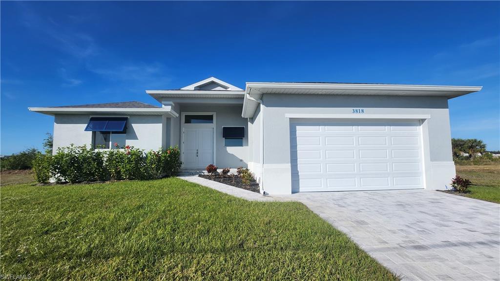 Lowest new construction waterfront available. Take advantage of the newest building codes and high elevation! **BUILDER INVENTORY CLEARANCE SALE! BRAND NEW WATERFRONT MOVE-IN READY 4 BEDROOM HOME!! Certificate of Occupancy already in place!! $50,000 OF UPGRADES INCLUDED!  BEST PRICED HOME IN CAPE CORAL WITH THIS MANY UPGRADES! 13+ FOOT VAULTED CEILINGS! **BRICK PAVER DRIVE + WALKWAY! 100% UPGRADED WOOD-LIKE TILE FLOORS THROUGHOUT! **AUTOMATIC SPRINKLER SYSTEM! **UPGRADED SOD! **GIGANTIC WALK-IN SHOWER **OVERSIZE LAUNDRY/UTILITY ROOM! **SOFT CLOSE SYSTEM ON ALL CABINET DOORS! **DECORATIVE BERMUDA SHUTTERS IN FRONT** A MUST SEE!!!!!!!!! This move-in ready home in Cape Coral presents an exceptional opportunity for prospective buyers. Want a deal? This is priced $50,000 less than comparable homes. This property offers outstanding value in today's market. With a generous 1900+ square feet of open living space and a 2-car garage, this home is designed to accommodate the needs of almost any size family. As you approach the home, the brick-paver driveway and walkway create a welcoming entrance, complemented by the towering entryway and meticulous landscaping. Inside, the attention to detail is evident, with tall ceilings, wide baseboards, and lots of natural light adding a touch of sophistication to every room. The wood-like tile floors provide durability and style, offering a seamless flow throughout the living spaces. The kitchen is a chef's delight, featuring white raised panel cabinets with slow-close doors and drawers, a large island with a stainless sink, and a full 4-piece upgraded stainless-steel appliance package. The split-bedroom layout provides privacy for the occupants, with the master bedroom serving as a luxurious retreat. Luxurious bathroom with an enormous closet and a beautifully appointed master bathroom with dual sinks and a frameless glass shower wall add to the appeal of the space. In summary, this meticulously designed and upgraded home offers luxury living at an unbeatable price. With its quiet location, desirable features, and significant price, it represents a rare opportunity for buyers looking to own a piece of paradise in Cape Coral.  Some photos of the furniture in this listing have been virtually rendered.