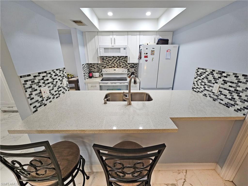 What an opportunity to own a piece of paradise in a great community with Tennis, shuffleboard. A gigantic pool with lots of chairs, tables and lounging areas. A large community club house. Low Monthly HOA fees also includes your water and Cable. As you enter the beautiful well-kept community with a roundabout and waterfall you will know this is the perfect place to call home.
This condo has been beautifully updated as you will see in the photos. This Two Bedroom Two Bath home also has a screened in covered Lania with storage and laundry. Parking is right in front of the unit. This is a 55 and older community waiting for you to have fun in the sun. Close to all shopping, restaurants. Don't miss out.