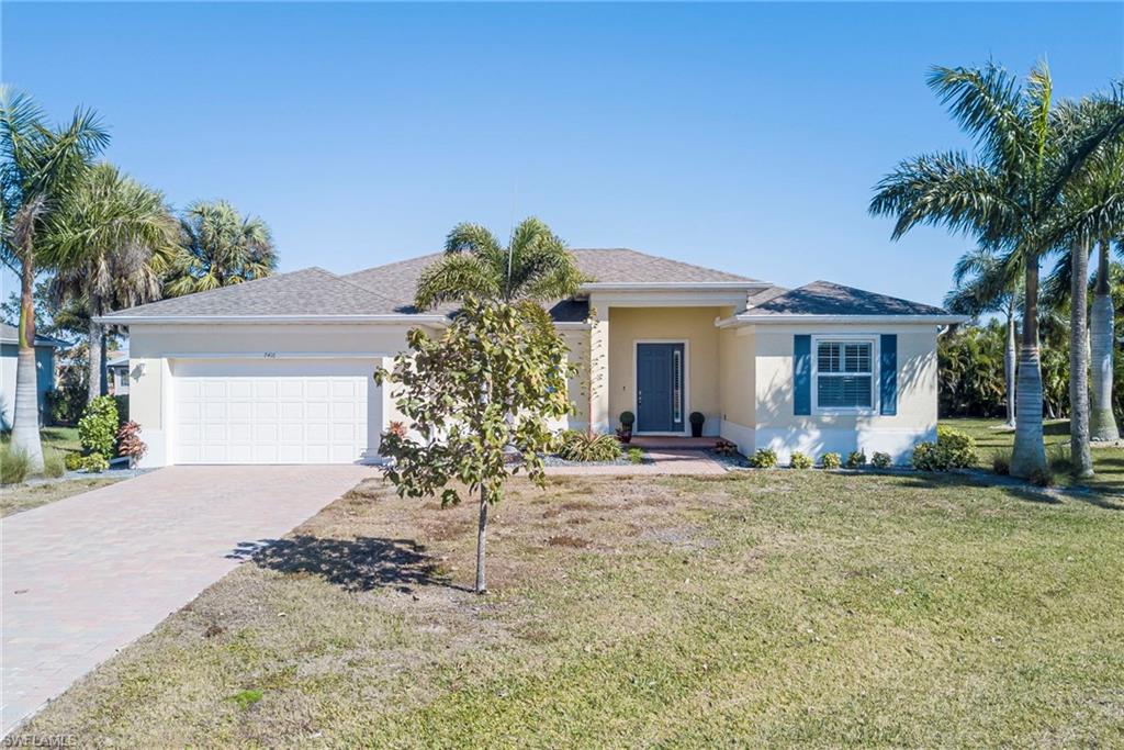 Built in 2022 and located in deed-restricted Burnt Store Meadows, this 3-bedroom plus den home offers a bright, open great room layout with split bedrooms and an attached 2-car garage featuring a mini-split A/C for added comfort and flexibility. The kitchen features white cabinetry, stainless steel appliances, a center island with a sink, and an eat-in dining area that flows seamlessly to the main living space. Tile flooring runs through the main areas with carpet in the bedrooms. The primary suite includes a walk-in closet and an ensuite bath with dual sinks and a walk-in shower. Enjoy the covered lanai out back. Additional highlights include an interior laundry room with washer and dryer included, impact-resistant windows, central water and sewer, and a low annual HOA fee. Convenient to US-41 and Burnt Store Road for shopping and dining. Buyer to verify all information and measurements.
