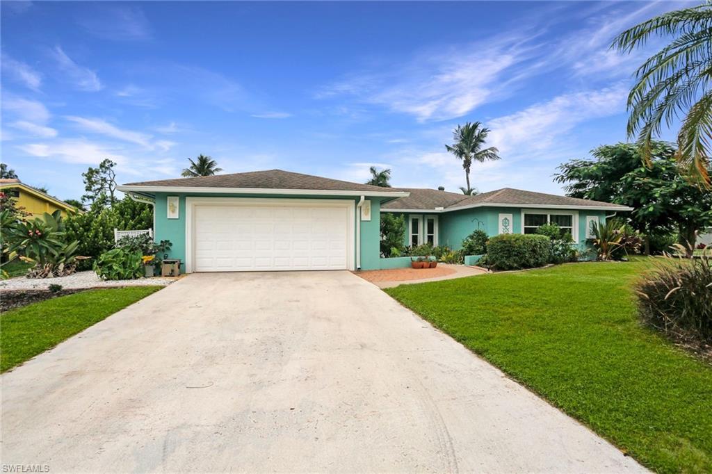 A breath of fresh air! You will LOVE coming home to this gorgeous, open and bright home situated on a generous CORNER lot with lovely tropical plantings (avocado, mango, lemon and banana!) A fish pond welcomes you at your front door. Once inside this immaculately maintained residence, your eyes will be drawn directly out the back sliders to the sparkling pool and spacious patio area. The open floor plan allows for plenty of natural light and features neutral paint tones and beautiful tile floors throughout, including travertine in the master bath. So MUCH to BOAST about in this home - beautifully updated kitchen and baths, large walk-in closet in master bedroom, large master bath shower, oversized attached 2 car garage, windows/sliders new in 2015, A/C new in 2017, pool pump new in 2016, pool salt filter new in 2017, gutters new in 2015 and new (April 2019) Whirlpool washing machine. Convenient location inside Lely Golf Estates, (just out your side yard and onto the golf course), along with easy access to Tamiami Trail East and it's numerous shopping and dining options, makes this special home a rare find!