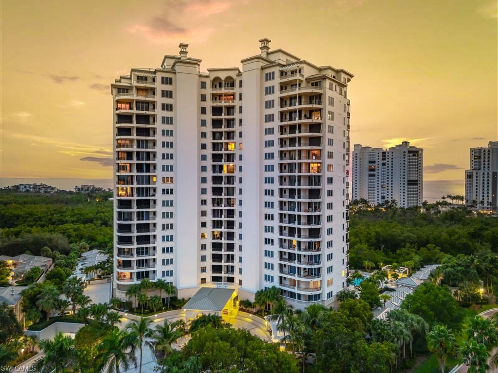 This elegant, impeccable high-floor corner end unit occupies one of the most coveted and desirable positions in the Salerno at Bay Colony, offering sweeping wraparound views of the Gulf, Bay, and the Naples skyline.