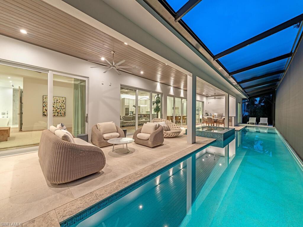 Experience the epitome of luxury living at 4234 Crayton Rd, where elegance meets unparalleled comfort. Nestled in the prestigious Park Shore neighborhood, this remarkable residence is elevated above standard construction codes, ensuring exceptional safety and resilience for peace of mind. This exquisite home features four spacious en-suite bedrooms, two elegant half-baths, and a sophisticated den, all thoughtfully designed to embrace the quintessential Florida lifestyle. As you enter, you'll be greeted by a beautifully furnished open-concept living area that flows seamlessly into a gourmet kitchen, showcasing top-of-the-line Wolf and SubZero appliances, complemented by a stunning waterfall island—a true paradise for culinary enthusiasts. Perfect for entertaining, the expansive outdoor living space beckons with a luxurious spa, lap pool, and an outdoor kitchen, all adorned with rare large-slab shell-stone decking. The interiors are further enhanced with wide plank European wood floors and single-sheet porcelain bath floors, radiating sophistication and style. This extraordinary home is equipped with impact windows and doors, solid mahogany garage doors, and WiFi-enabled components, allowing for effortless control and monitoring from anywhere. Enjoy the convenience of walking to the beach and Venetian Village, or take a short golf cart ride to the vibrant shopping, dining, and entertainment options of 5th Avenue and 3rd Street. Investing in this stunning property means prioritizing your family's security, comfort, and a lifestyle that is truly extraordinary. Embrace the luxury you deserve in a home that is not just a residence, but a sanctuary.