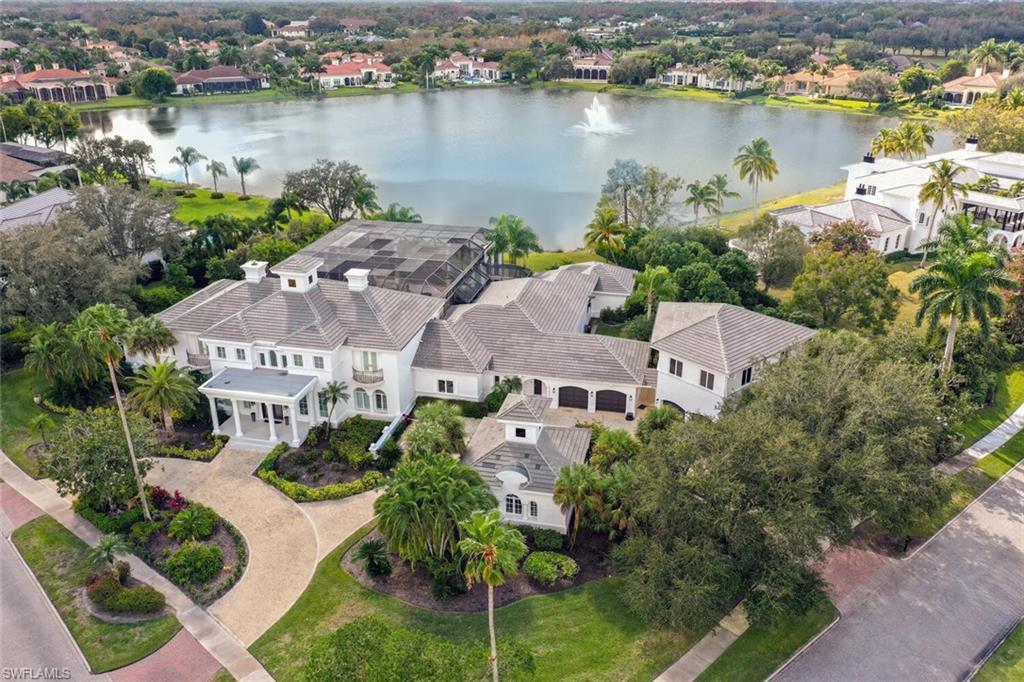 Sunspray Estate located on magnificent spring fed lake with dazzling sunlit fountain facing south west. This is the only home for sale on the lake.  The “bones” of this 5 bedroom estate are exceptional. Fast forward 2024 several upgrades completed including new flat tile roof. The 9495 Sq Ft home is sleek, contemporary theme, sky high windows, walls of glass that disappear, dramatic high ceilings crowned with blue blown glass chandelier, double sided fireplaces, crisp white backgrounds & L E D lighting. Step out to a 6000 sq ft lanai with coliseum screened in enclosure. Negative edge 60’ pool, stepping stones, spa & tropical gardens.  Guest cabana / mini bar and full bath. Car collectors will appreciative 6 air conditioned garages plus a bonus room over the two story garage.3 driveways, motor courts all on this impressive 1.37 acre corner lot. Luxurious primary suite /3 huge closets, two bathrooms, lavish sitting area /fireplace, office /built in shelves. 3 suites on second level (elevator) each with private balcony and new baths. Enjoy the Ultimate lifestyle at Quail West Golf & County Club. Inquires on membership contact Jenni Taylor 239-593-4190.