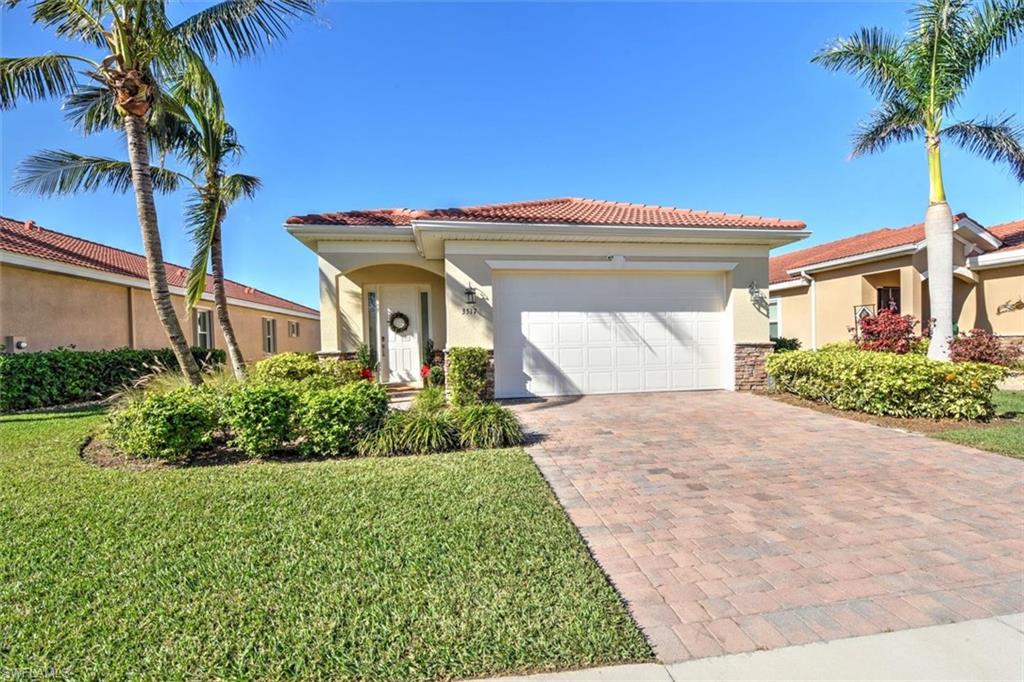 This open and bright home features high ceilings, abundant natural light, eight-foot doors, and shows like new. Recent updates include a new refrigerator, new washing machine, new blinds throughout the home, and new carpet in the primary bedroom. A recently cleaned roof and an unseen retractable front screen door add to the home’s thoughtful maintenance and comfort. The beautifully designed kitchen offers 42” staggered cabinetry with crown molding, under-cabinet lighting, granite countertops, and stainless-steel appliances — providing both style and functionality. Interior upgrades include tile set on the diagonal in the main living areas, tray ceilings in the living room and primary bedroom, upgraded lighting fixtures, and spacious daylight windows that enhance the home’s airy feel. Step out onto the patio — the perfect place to unwind while taking in stunning sunset views over the lake and golf course. The peaceful setting creates an exceptional backdrop for everyday living. The garage includes an EV charging plug for electric vehicles, adding modern convenience. Stay connected with integrated Smart Home features including a Ring doorbell, security camera, and smart locks on both the front and garage doors. Residents of Magnolia Landing enjoy outstanding amenities including a resort-style pool, lap pool, fitness center, pickleball, bocce ball, and shuffleboard courts. HOA dues cover HD cable, landscaping, irrigation, on-site management, and more — providing convenient, low-maintenance living. Optional golf memberships are available for the 18-hole Championship course, golf shop, and on-site restaurant. Ideally located just a short drive to shopping, dining, downtown Fort Myers, and Punta Gorda.