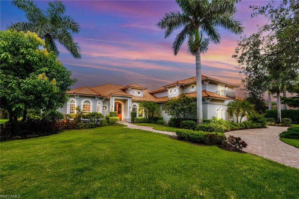 Rare oversized 4 plus car garage, Could fit 8 Mid sized cars - 60 x 30 feet deep! Huge Circular Driveway and wide driveway. RARE Metal roof 50 year life span, No flood/ water damage from Ian, property is high and dry. Welcome to Riverbrooke at West Bay Club, where this exceptional custom-built estate blends refined luxury with a true Southwest Florida lifestyle. Designed for both grand-scale entertaining and everyday comfort, this home offers 4,382 square feet of thoughtfully designed air-conditioned living space, paired with incredible outdoor areas that make the most of our year-round sunshine. The open-concept main level features four spacious bedrooms plus a dedicated den/office with built-in desk and cabinetry—perfect for working from home or managing household business. At the heart of the home is a stunning double-island kitchen with a 6-burner gas cooktop, double ovens, granite countertops, and a huge butler’s pantry complete with a library ladder. Whether you’re preparing an intimate dinner or hosting a crowd, this kitchen is as functional as it is beautiful. Upstairs, a versatile large bonus room with a half bath, wet bar, beverage refrigerator, and dishwasher provides an ideal space for game nights, movie marathons, or visiting guests. Step through sliding glass doors to your private resort-style lanai, where outdoor living takes center stage. Here, a custom, gas heated infinity-edge pool and spa invite you to relax against the backdrop of a sparkling lake, fountain, and nature preserve. Multiple covered and open-air seating areas, a fully equipped outdoor kitchen, and a west-facing view make this the perfect setting for sunset cocktails, alfresco dinners, or simply unwinding after a day on the golf course or at the beach. Peace of mind comes built in, with hurricane impact windows and doors, Kevlar screens, electric shutters, an emergency generator, a newer roof (2023), a newer pool cage (2024), and a brand-new well installed in 2025 for irrigation savings—while still having city water service for the home. The oversized 4-car garage is the perfect finishing touch, featuring a heavy epoxy coating and two 30-foot-deep bays ideal for boat or trailer storage, a workshop, or extra storage space for all your Florida toys. Living in West Bay Club means enjoying world-class amenities: a private Beach Club on the Gulf of Mexico with full food and beverage service, championship golf, Har-Tru tennis courts, pickleball, a boat ramp with direct Gulf access, a resort-style pool and spa, a state-of-the-art fitness center, and a clubhouse with both fine and casual dining. Ideally situated east of US-41, you’re just minutes from Coconut Point, Miromar Outlets, Hertz Arena, and 20 minutes from Southwest Florida International Airport. This is more than a home—it’s an entertainer’s dream and a luxurious retreat, all in one of the most sought-after communities in Southwest Florida.