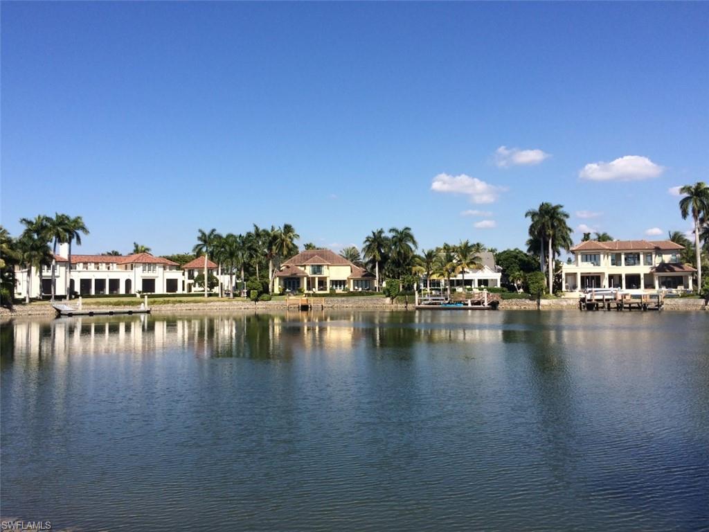 This oversized, cleared lot (.48 Acre) has a wonderful panoramic view across Hidden Bay and you are encouraged to drive by and see how beautiful your home would look on this lot. The virtual rendering of the estate home originally designed for this lot gives you an idea of the size home you can build here with this designed home containing 7,094 sq. ft. of air conditioned living space with 5 bedrooms, den, 6 full baths and 2 half baths, 3-car garage, pool, spa, large lanai with summer kitchen and pool bath. Architectural plans available. Port Royal Club Membership eligibility.