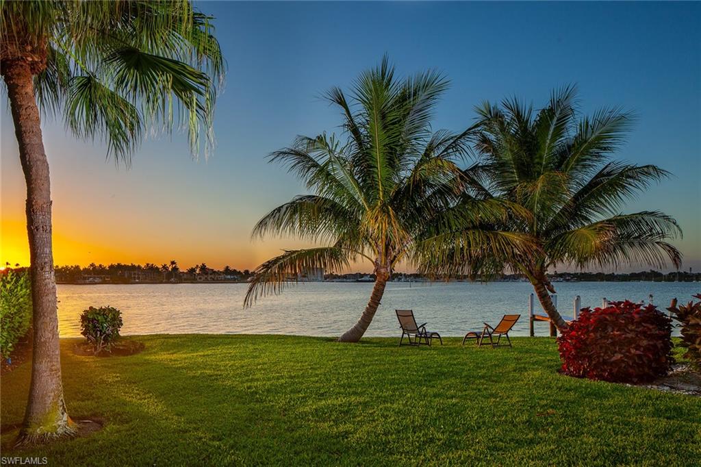 Panoramic sunset and bay views across the widest section of Naples Bay from this prime lot with rarely available, oversized 125 ft. of water frontage. This Naples jewel is among the best lots in Royal Harbor on a quiet cul-de-sac street. 1630 Dolphin Ct. offers deep water direct boating access to the Gulf (just minutes to open waters of the Gulf of Mexico). Current home has been lovingly maintained, has an excellent rental history, has big Bay views from every room, large rear yard, and is a great vacation home to use as you plan to build your future dream home.