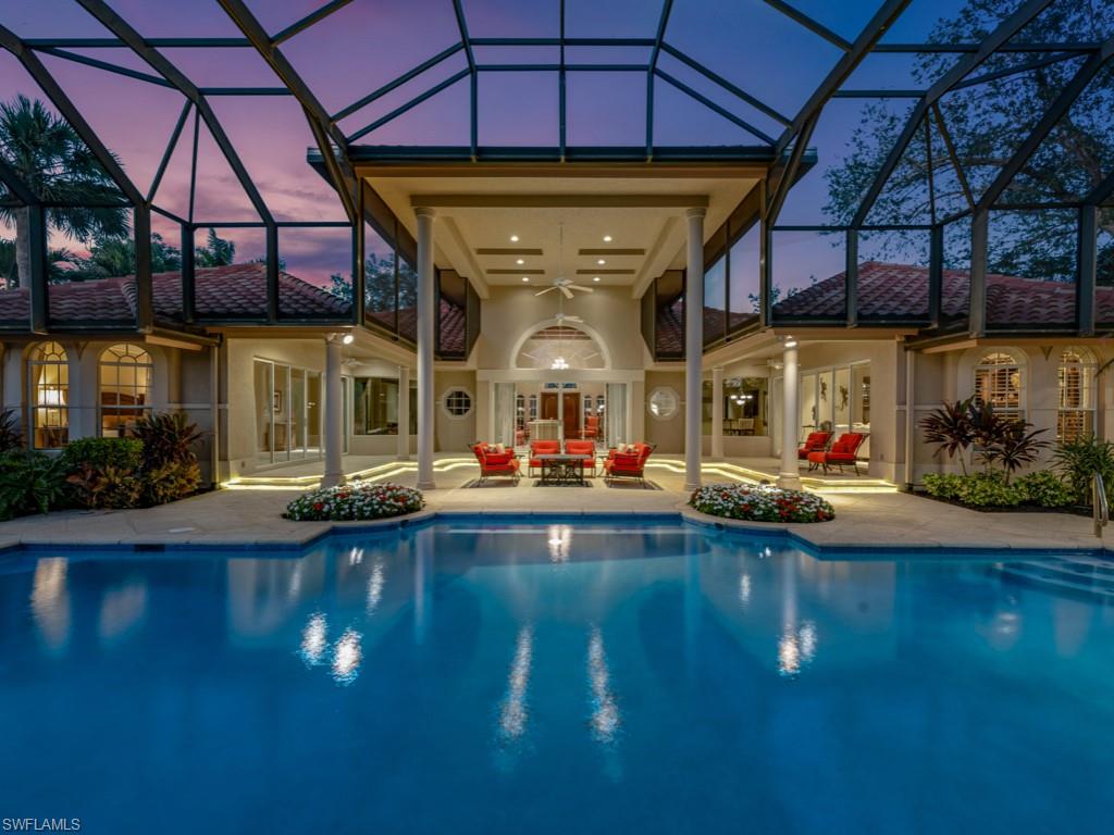 Welcome to your dream home in the highly sought-after Spring Ridge community of Bonita Bay. This stunning estate boasts 5,835 square feet of impeccable living space, featuring 5 spacious bedrooms plus a den, and 5 full bathrooms along with 2 half baths, perfect for families and entertaining guests. As you step into this custom home and into the living room, you are greeted by a volume ceiling and the view out to the resort style pool and lanai.  The travertine flooring creates a serene atmosphere throughout. The expansive great room, adorned with beautiful built-ins seamlessly flows into a lovely kitchen and leisure area, equipped with top-of-the-line appliances including a Sub-Zero refrigerator/freezer, Dacor gas cooktop, Miele double wall oven, and a convenient island with a vegetable sink. The showstopper of this estate home is the breathtaking lanai, complete with captivating water features, a fully equipped outdoor kitchen with built-in grill and bar seating, and spa. Whether you’re lounging by the spacious pool or enjoying the southwestern exposure golf course views of Marsh hole  #10, this outdoor oasis is perfect for relaxation and entertainment. The private cabana, overlooking the pool, offers an ideal retreat for guests or a special hobby space. Additional highlights include a game/movie room, a primary bedroom with direct access to the lanai, and a luxurious primary bathroom featuring dual sinks, a walk-in shower with dual shower heads, and a jetted tub. Equipped with modern conveniences such as a whole house generator, security system, surround sound, plantation shutters, and power-operated drapes. The 3-car air-conditioned garage features an epoxy floor and ample storage cabinets, ensuring functionality meets luxury. With its expansive covered sitting and dining areas, a firepit for cozy evenings, and a pool bath, this home is designed for gracious living. This exceptional property is truly a pleasure to see and the perfect setting for your Florida lifestyle. Don’t miss the opportunity to make this luxurious estate your own! As part of the master-planned Bonita Bay community, you’ll have access to 2,400 acres of beautifully landscaped grounds, a private beach park, and a variety of community parks. Engage in outdoor activities like kayaking and canoeing, or challenge friends to a game of pickleball or tennis. This home is a wonderful opportunity to embrace a relaxed lifestyle in Bonita Bay, surrounded by nature's beauty. Schedule your private tour today!