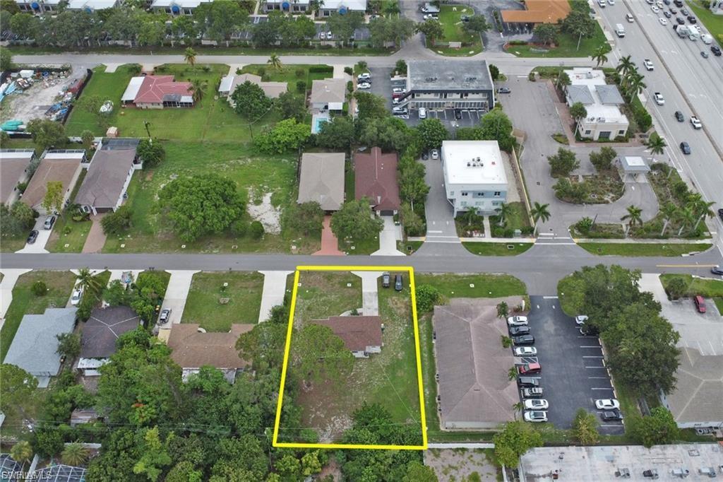 INVESTOR ALERT! Rare opportunity to own a 0.30-acre double lot in the heart of Naples Park, zoned Commercial C-3, offering exceptional flexibility for residential, multifamily, mixed-use, and a variety of commercial opportunities (buyer to verify permitted uses). Ideally located just moments from Vanderbilt Beach and directly across from Mercato, one of North Naples' premier destinations for upscale dining, shopping, entertainment, and nightlife. This highly desirable location offers outstanding visibility, convenience, and long-term investment potential. The existing 913 sq. ft. home features 2 bedrooms, 1 bathroom, and a 1-car garage. Recent updates include modern finishes, newer flooring throughout, stainless steel appliances, and a 2018 roof, making it suitable for immediate occupancy, rental income, or redevelopment while planning your future vision. Whether you're an investor, developer, business owner, or end user, this is a rare opportunity to own one of the few commercially zoned double lots in one of Naples' most sought-after and rapidly growing locations.