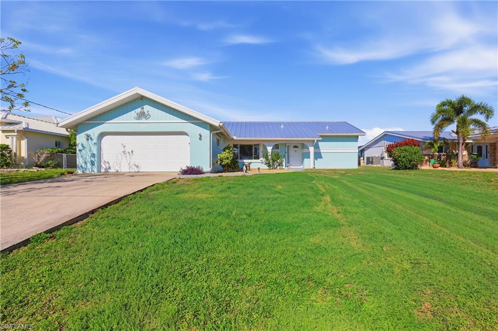 Spacious 2,000+ sq ft home with stunning views of Spring Lake. Ideal for in-law situation, kids that need extra space or vacation rental.  It features  3 bedrooms, den, extra sitting room, 3 bathrooms, and separate living area. Large screened lanai with boat slip. 15-minute boat ride to Charlotte Harbor from the newer composite dock and slip. 2-car garage, great neighborhood, new metal roof (2023), dual air conditioners one from (2019).  The salt water 10x40  heated pool is perfect for doing laps while watching the gorgeous sunsets on the Lake. New Pool Heater (2024) It is very tastefully furnished and being sold turnkey. New composite boat dock with designed to hold a 14,000 lb lift. Schedule your showing today!