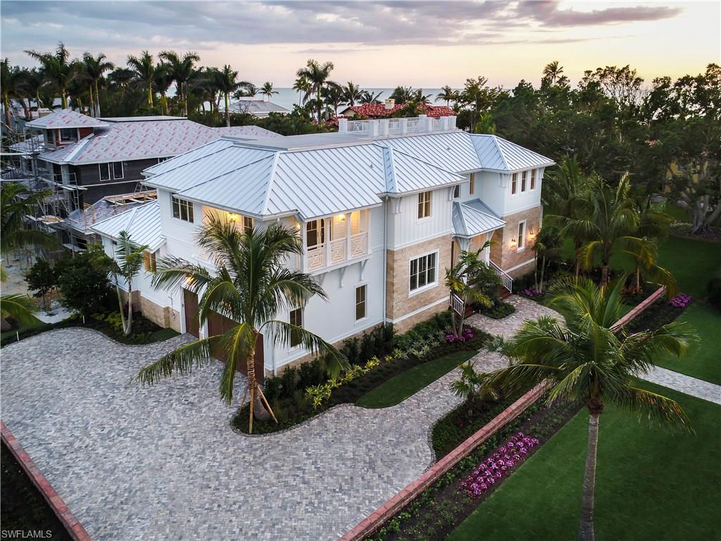 New construction on the beach-block in the heart of Olde Naples! Ideally set in the Golden Triangle between 5th Avenue and 3rd Street and just steps from the sand, "The 8th Avenue Beach House" is sited in one of the most sought-after locations in town. Foresite Homes has partnered with Freestyle Interiors to create yet another masterpiece, inspired by Naples' pristine beach. Thoughtfully designed by MHK, the great-room floor plan provides for 5 bedroom suites, his and hers offices and living rooms on both levels. A sunlit two-story living room, dining area, and gourmet kitchen all open to the pool and outdoor living spaces. Above the outdoor living room is a private deck offering an additional sunning and entertaining area. The luxurious ground floor master suite is complete with a finely appointed bath and custom closets. On the second level are 4 additional bedroom suites and a private living room and kitchenette. Other conveniences include an elevator which serves the three car garage as well as both living levels and utility rooms on each floor. The 8th Avenue Beach House offers a carefully planned, designed and beautifully furnished home in the best location in Olde Naples.