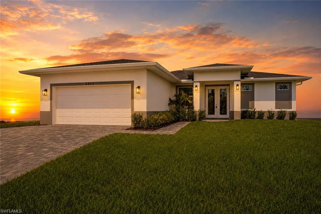 Exceptional Value – Move-In Ready 2024 Home in NW Cape Coral!
Built with quality and style in mind, this home features high-impact windows and doors, 10-foot tray ceilings, 8-foot interior doors, porcelain tile throughout, quartz countertops, soft-close cabinetry, stainless steel appliances, and an open-concept floor plan ideal for both everyday living and entertaining. The spacious primary suite offers a walk-in closet and a spa-inspired bathroom with dual vanities, a soaking tub, and a separate glass-enclosed shower. No HOA. The property also includes a Letter of Map Amendment, providing an important added benefit for future ownership.