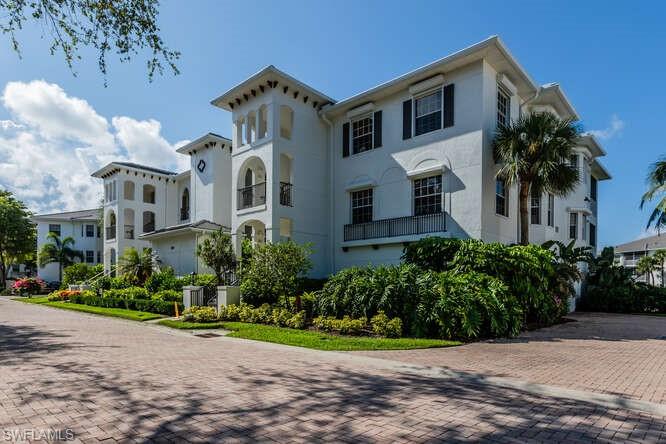 This property is in  Pelican Bay, located in Breakwater subdivision. This end unit provides great light, excellent lake view, open floor plan, with master suite separated from guest rooms. Shutters on Lanai are automatic and are also rain activated. Elevator provides access to dedicated 2 car private garage, and makes this unit handicap accessible. Breakwater is pet friendly and offers a clubhouse with resort style pool, workout room, card/party room and much more. As part of Pelican Bay, residents have access to tennis and pickleball courts, a large fitness center, walking/biking paths and beach access. The beaches are on the Gulf, and Pelican Bay provides  shuttle services and restaurants for convenience. Breakwater is located within blocks of shopping and restaurants.