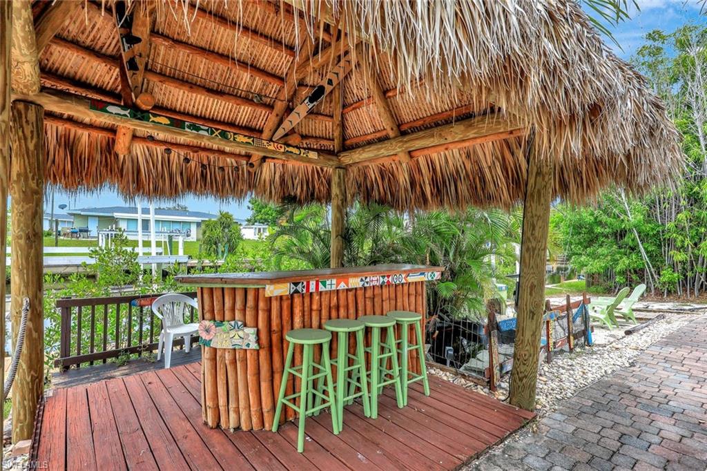 Welcome to 341 Duxbury Avenue, an exquisite boater's haven nestled in the vibrant community of Port Charlotte. Split bedroom home features an open concept and 3-bedroom, 2-bath residence, and unparalleled Gulf access, making it a premier destination for those seeking both relaxation and adventure along the picturesque Charlotte Harbor. Experience what southwest Florida is about - suitable for any lifestyle. Well manicured entrance - residents will be welcomed by a stunning courtyard, highlighted by a jasmine-lined trellis that sets a serene and inviting tone. Step inside to find a bright and open living space that seamlessly connects to the dining area and a beautifully appointed kitchen. With granite countertops, a chic tile backsplash, a pantry, and an inviting eat-in island, the kitchen is designed for both culinary delights and social gatherings. 341 Duxbury Avenue also features a thoughtfully designed split floor plan, ensuring privacy with the master suite on one side and guest accommodations on the other. The expansive screened-in patio serves as a perfect retreat for embracing the renowned Florida sunshine. Experience the beloved community of Port Charlotte, known for its friendly and active ambiance that caters to diverse lifestyles. Indulge in local culinary gems such as Twisted Fork, Half Cracked Tiki Shack, and Portside Tavern. For a touch of leisure, the Tiki bar offers refreshing libations, while mornings are best enjoyed by the tranquil sanded fire pit. Noteworthy enhancements include a METAL ROOF (2023), an updated ELECTRIC PANEL (2021), and HURRICANE SHUTTERS, ensuring comfort and security. Strategically positioned minutes from open water, this home offers convenient access to medical facilities, shopping, and the dynamic downtown Punta Gorda. Immerse yourself in this exceptional Florida retreat and schedule your visit today to explore all that 341 Duxbury Avenue has to offer.