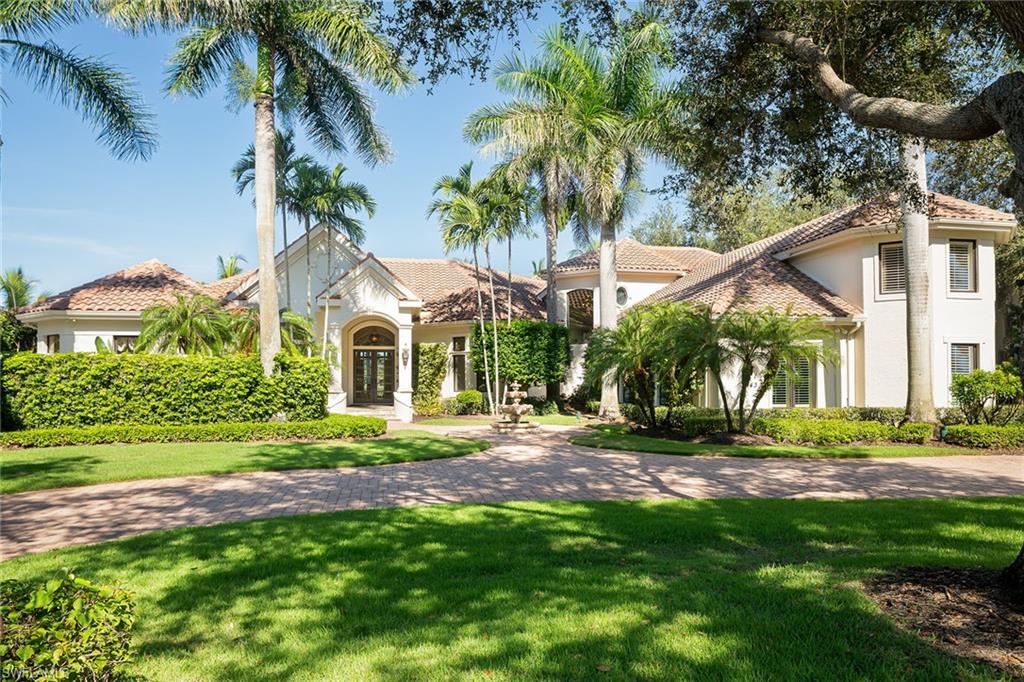 Located in the exclusive Bellflower estate community in award-winning Grey Oaks Country Club, this elegant custom home is westerly with exceptional private and wide golf fairway views to the newly renovated championship Pine Course. Well-appointed and gracious, the home was designed for personal relaxation and entertainment. The spacious primary bedroom suite features a sitting area, slider access to the lanai and two custom walk-in closets. The main floor guest wing has two en-suite bedrooms with one accessing the lanai. Sunny and well-appointed, the kitchen and great room enjoy access to the lanai which is perfect for entertaining, oversized with a fireplace and summer kitchen. There is a custom built-in wet bar in the living room. The second floor has three bedrooms, two en suite, a commanding office and den in addition to the one on the main floor, refreshment area and patio access. Grey Oaks is an award-winning club with fabulous amenities, including three golf courses, a 30,000-square-foot wellness center, active tennis and pickleball, fitness and social programs. Old Naples, fine dining, the beaches, and international and private airports are easily accessible.