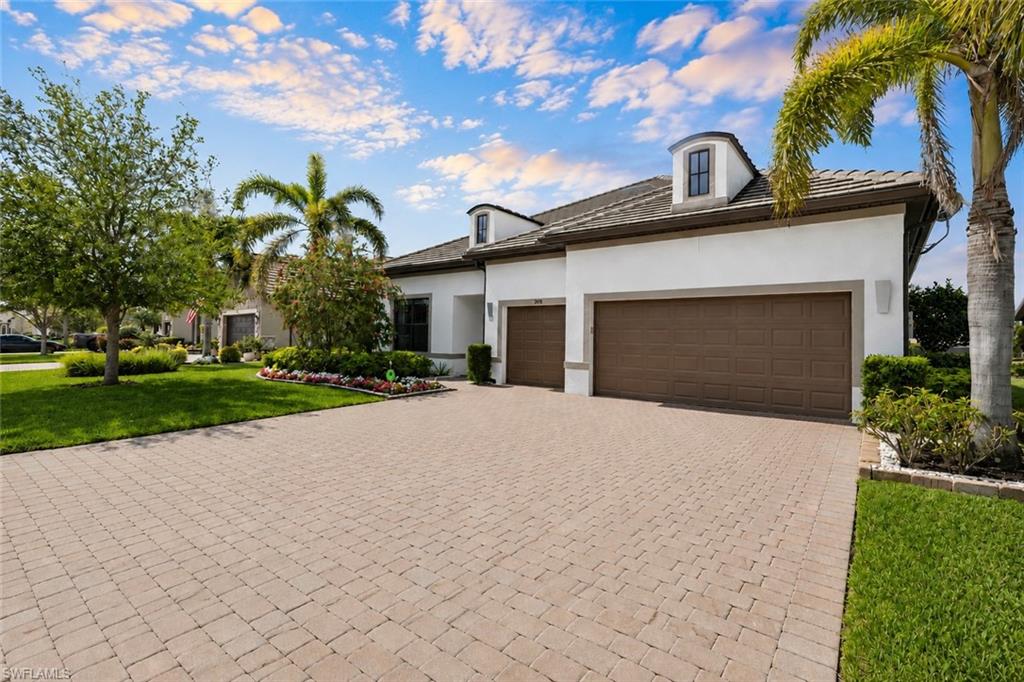 BRING OFFERS! Welcome to this highly upgraded Infinity Model, a rare offering in the prestigious Winding Cypress community of Naples. Built by renowned DiVosta Builders, this residence is one of only three Infinity Models within a community of more than 750 homes, making it an exceptionally unique opportunity. Featuring an extra-wide three-car garage with a dedicated third bay ideal for a golf cart, hobby vehicle, or additional storage, this home has been significantly enhanced with premium upgrades throughout and offers a level of quality rarely found in today's market. Designed for both luxury and everyday comfort, the expansive open-concept floor plan showcases soaring tray ceilings exceeding 11 feet, custom faux painting, extensive crown molding, and elegant designer finishes throughout. The spacious great room seamlessly connects to the gourmet kitchen, highlighted by a six-burner Thermador gas range and cooktop, premium Liebherr refrigerator, custom cabinetry, and a massive leather-finished quartzite island perfect for entertaining. The seller's extensive investment in upgrades is evident in every detail. Designer window treatments, custom bed coverlets, built-in features, and custom closets throughout create a refined, move-in-ready environment. The completely remodeled primary bath offers a spa-inspired retreat featuring a curbless walk-in shower, floating vanity, premium fixtures, designer tilework, and stunning 48-inch porcelain tile flooring throughout. Outdoor living is equally impressive. The expansive lanai with desirable western exposure captures spectacular Naples sunsets and provides ample space for a custom pool, spa, and additional outdoor living areas. Pool plans and contractor quotes are available, making it easy for the next owner to create their ideal backyard oasis. The fully equipped outdoor kitchen provides the perfect setting for entertaining family and friends while enjoying the privacy and tropical surroundings. Additional upgrades include hurricane-impact windows and doors, a dramatic zero-corner sliding glass door, whole-house generator, tankless water heater, Kinetico water filtration system, Sonos surround sound system, epoxy-coated garage floors, insulated garage doors, built-in garage storage, and a dedicated air-conditioning system for the garage. As one of Naples' premier natural gas communities, Winding Cypress offers an unmatched lifestyle with a residents-only restaurant, resort-style pool and spa, fitness center, pickleball, tennis and bocce courts, and over 800 acres of protected preserve. Ideally located just 10 minutes from Marco Island's white sand beaches and approximately 15 minutes from Olde Naples, this exceptional residence combines rarity, luxury, and location in one extraordinary offering. This is more than a home—it's a statement of quality, craftsmanship, and lifestyle. One or more photos have been virtually staged, AI-generated, or rendered.