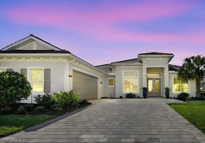 This stunning Bougainvillea II Model. 3 Bedroom + Study with Murphy Bed, 3 Full Baths, 2 Car garage home,  overlooking 2 lakes & the golf course is available to become your personal retreat in Paradise at The National Golf & Country Club of Ave Maria. This is arguably The Best Floor Plan & Lot that is available.
The purchase of this Home INCLUDES GOLF MEMBERSHIP and is TURNKEY.
This home has an elegant OPEN DESIGN with 12 FT. CEILINGS in the Great Room, Dining Room, Kitchen & Kitchen Nook.
From the moment you walk in the front door you will be taken by the grandness of the BLACK MARBLE floor to ceiling Fireplace & 85 inch TV wall, decorative floor to ceiling draperies, UNIQUE COUNTER TO CEILING WHITE MODERN OCTIGON BACKSPLASH in the Kitchen and Bar area, CUSTOM EBONY CABINETS, White Quartz Countertops throughout the home and Built-in Closets in the Owner's Suite. 
Access the Spacious Lanai with Heated Pool & Spa from the Great Room, Owner's Suite or Guest Suite where the sunset views are simply breathtaking.
These are just a few examples of what this Grand Home has to offer. You just have to SEE IT & FEEL IT for YOURSELF to FULLY APPRECIATE!