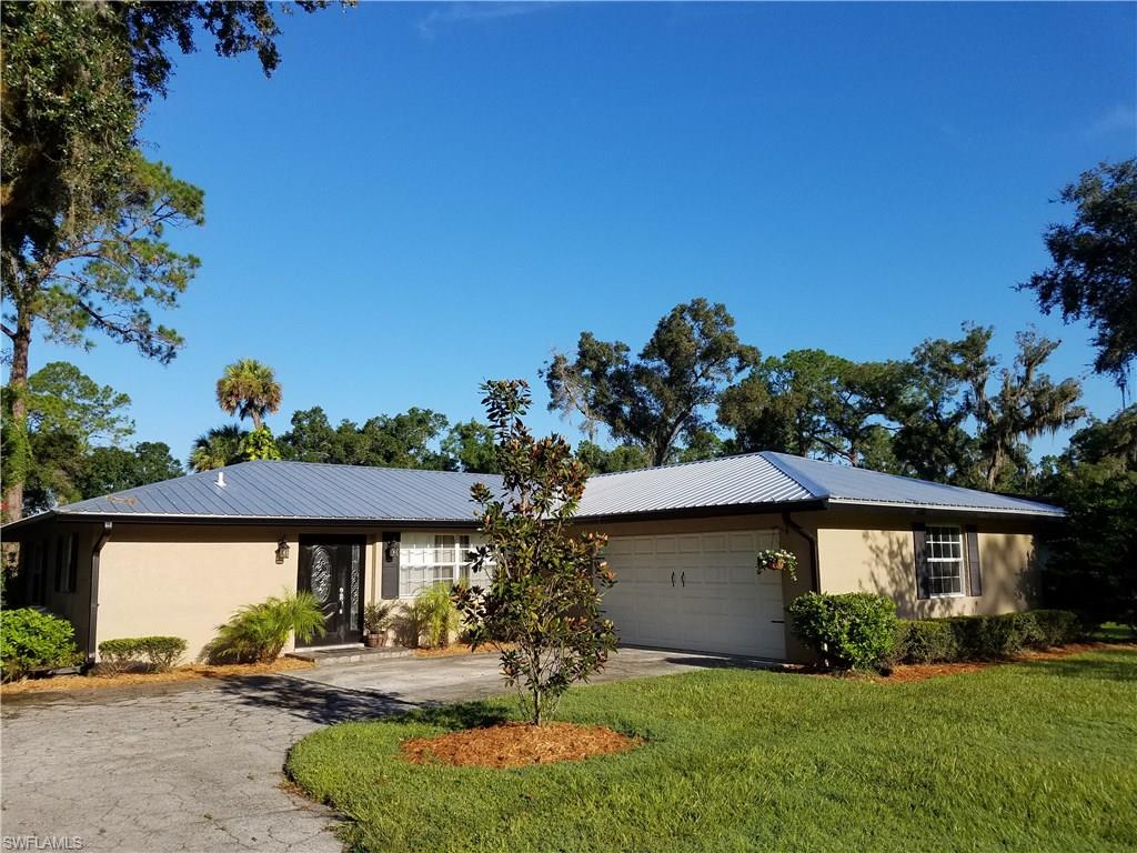 Experience the "Magnetic Attraction" when you step inside this attractive 3 bedroom, 2 bath home peacefully situated on Pollywog Creek in Caloosa Estates. This picture perfect home is ready to move into and be enjoyed! Featuring a stunning kitchen with granite countertops and a large magnificent island the whole family will love. The flowing floor plan is complimented with laminate and tile floors throughout. This home has recently been updated with new thermal windows, a new metal roof, new plumbing and electric. Outdoors you will find a great 24 x 36' pole barn and a fenced back yard for the kids and pets. Walk down the embankment to scenic Pollywog Creek, throw in a line or cast off in a kayak and explore the Caloosahatchee River.  Caloosa Estates is a peaceful neighborhood for your morning and evening walks or bike rides. Don't let this gem pass you by, schedule your showing quickly!