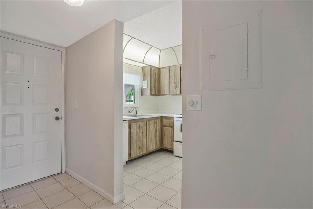 PRICE REDUCED  15-102 a cheerful 55+ retreat in one of Naples’ friendliest, most activity-filled communities.  
This first-floor 2-bed, 2-bath condo offers comfort, convenience, and a lifestyle that feels like vacation every day.  Take a short walk outside and enjoy a large heated pool, bocce games and tournaments, pickleball, tennis, a grill area, and a lively clubhouse packed with activities and friendly people. From dances and bingo to mahjong, card games, dinners, and movie nights, there’s always something fun happening and always someone to enjoy it with.
You’ll also love the the soon-to-open “The Gate” 9-hole public golf course, complete with driving range and restaurant—an exciting new addition right in your backyard.
Inside, the condo features **LV AND TILE flooring**, **impact-resistant windows**, and  **slider to the lanai**. Appliances are included, and the **washer/dryer is conveniently located on the lanai** for easy everyday living.This property is also a **fantastic investment opportunity**:  Short-term and long-term rentals are allowed immediately upon purchase.**

The location is unbeatable—close to **shopping, dining, medical facilities, banks**, and everything you need. And when you’re ready for adventure, you’re just **9 miles from Naples’ sugar-sand beaches and world-famous 5th Ave S** with its boutiques, galleries, and restaurants. Spend a day at the **Naples Zoo**, where you can visit Monkey Island or feed the giraffes, or explore the many natural and cultural treasures of Southwest Florida.

**Friendly neighbors, endless activities, and a prime Naples location—this is the lifestyle you’ve been waiting for.**