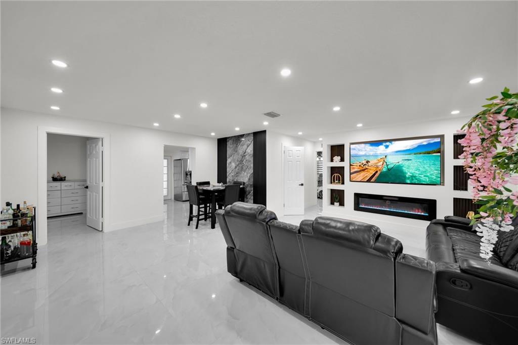 Welcome to this beautifully remodeled 4-bedroom, 2.5-bath home in the heart of North Fort Myers, offering the perfect blend of comfort, space, and outdoor living. Step outside to your own private oasis featuring a screened-in pool, a spacious covered lanai, and an oversized outdoor kitchen—ideal for entertaining family and friends year-round. Dedicated laundry room and outdoor pool bath.

Inside, you’ll find a functional floor plan where every space is designed to make you feel warm and comfortable, with a beautiful finish and good taste. The expansive backyard is lined with mature fruit trees, providing both privacy and a peaceful setting.

Additional highlights include an electric vehicle (EV) charging station, ample parking with no HOA parking restrictions, and plenty of room for your boat, RV, work vehicles, or additional toys. Conveniently located near shopping, dining, schools, parks, and major roadways, this home offers the freedom and lifestyle you’ve been looking for.

Don’t miss this rare opportunity to own a property that combines space, convenience, and exceptional outdoor amenities in a very friendly and quiet neighborhood.