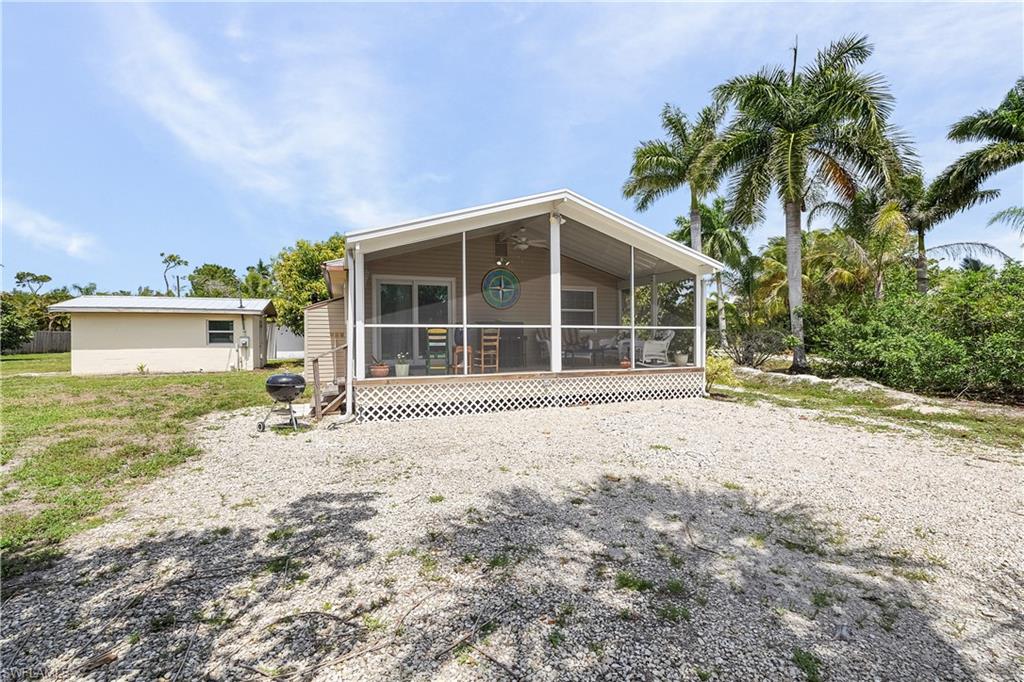 Welcome to your dream island retreat at 7257 Victory Rd in charming Bokeelia, FL! This beautifully remodeled 2-bedroom, 1-bathroom home is nestled in the serene enclave of Pineland, at the north end of Pine Island. Situated on a.42 acre lot, this home boasts modern upgrades including stainless steel appliances, tile floors, impact windows and doors, and a newer central A/C system. Enjoy peace of mind with updated electric panels and a durable metal roof. The spacious 24' x 38' garage with a newer shingle roof offers endless possibilities while the large screened porch invites you to unwind. Explore nearby marinas and boat ramps, or savor the delightful local dining. Perfect for nature lovers and boating enthusiasts! Don’t miss this gem! THIS. HOME HAS NOT FLOODED.