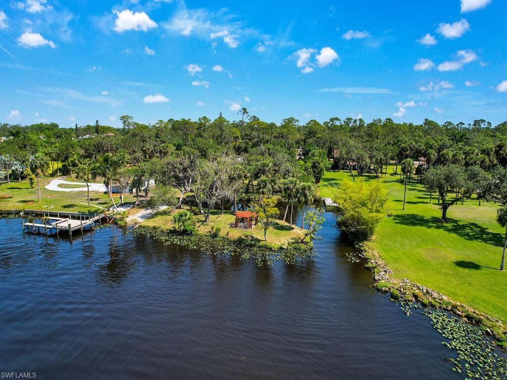Welcome to this charming Old-Florida style home nestled on a sprawling 1.47ac riverfront property. As you step inside, you'll be captivated by the picturesque water views that greet you from the living areas. The French doors beckon you to step out onto the screened wrapped porch. Adding a touch of history and elegance, an amazing transom sliding stained glass window, collected from an old building in Boston, graces the home. The spacious primary suite features a private updated bath and a separate sitting/office area. The guest bath has been recently redesigned and boasts a charming claw foot tub. The layout of this residence has been thoughtfully designed to create functionality and privacy. The property itself is adorned with several mature live oaks, sabal palms, and various other plantings grace the grounds. The property has a newer septic system for your convenience. One of the unique features of this home is its approximately 145' of river frontage, with private, protected boat basin. With two bedrooms and two bathrooms, this home is perfect for those seeking a cozy retreat or a serene year-round residence. Embrace the beauty of Old-Florida living in this idyllic setting.