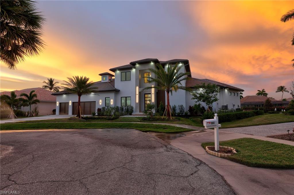Discover the epitome of luxury living in this spectacular new construction waterfront of Marco Island. Oversized lot with 160' of the newer seawall. This residence is a masterpiece of contemporary design, offering an unparalleled blend of opulence, and coastal charm. Step inside to discover an open-concept living space adorned with 13' high ceilings and an abundance of natural light with lots of windows and doors, all with high-impact glass. Every detail has been meticulously designed to create an atmosphere of refined elegance, from the grand foyer to the expansive living areas that flow effortlessly into the outdoor oasis. The heart of the home features a gourmet kitchen equipped with the latest appliances, custom cabinetry, and premium finishes. The exterior is a haven of relaxation and entertainment. From custom pool/ spa and timeless design. This new construction waterfront home in Marco Island represents the pinnacle of coastal luxury, where modern design, unrivaled amenities, and natural beauty converge to create a residence that transcends the ordinary. Welcome to a life of tranquility on the canals of Marco Island.