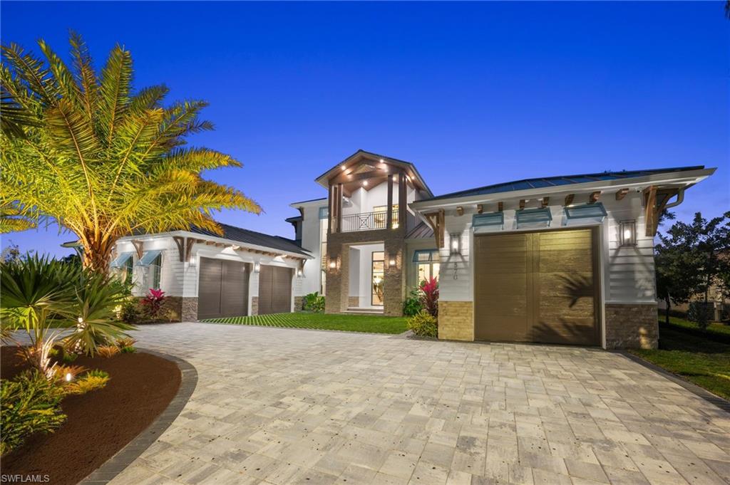 Enjoy sweeping southern exposure and serene golf course views from this exceptional new construction residence in the prestigious Moorings. Designed by Boyatt Design with interiors by the award-winning Design West, and expertly built by Naples Luxury Builders, this home delivers timeless elegance with modern luxury at every turn. The thoughtfully designed floor plan offers effortless living, with the master suite, an additional guest bedroom, and a private office all conveniently located on the first floor. At the heart of the residence is an oversized chef’s kitchen featuring Wolf and Sub-Zero appliances, a double island, and a butler’s pantry—perfectly positioned to flow into the main living areas. Detailed ceilings, refined flooring, and abundant natural light enhance the sophisticated yet welcoming ambiance throughout. The first-floor master suite is a true retreat, complete with a fireplace, his-and-hers walk-in closets, and a spa-inspired bath. A private elevator leads to the second level, where guests can unwind in a spacious leisure room with fireplace and wet bar, along with a second laundry room and guest suites featuring ensuite baths and private balconies. Outdoor living is equally impressive, showcasing a resort-style pool and spa, outdoor kitchen, fireplace, and fire features—all framed by lush landscaping and picturesque golf course views. Located in an X500 flood zone, the property also offers peace of mind alongside its many luxuries. Just minutes from downtown Naples and less than a mile from beach access, this remarkable home blends location, design, and lifestyle—your perfect place in paradise