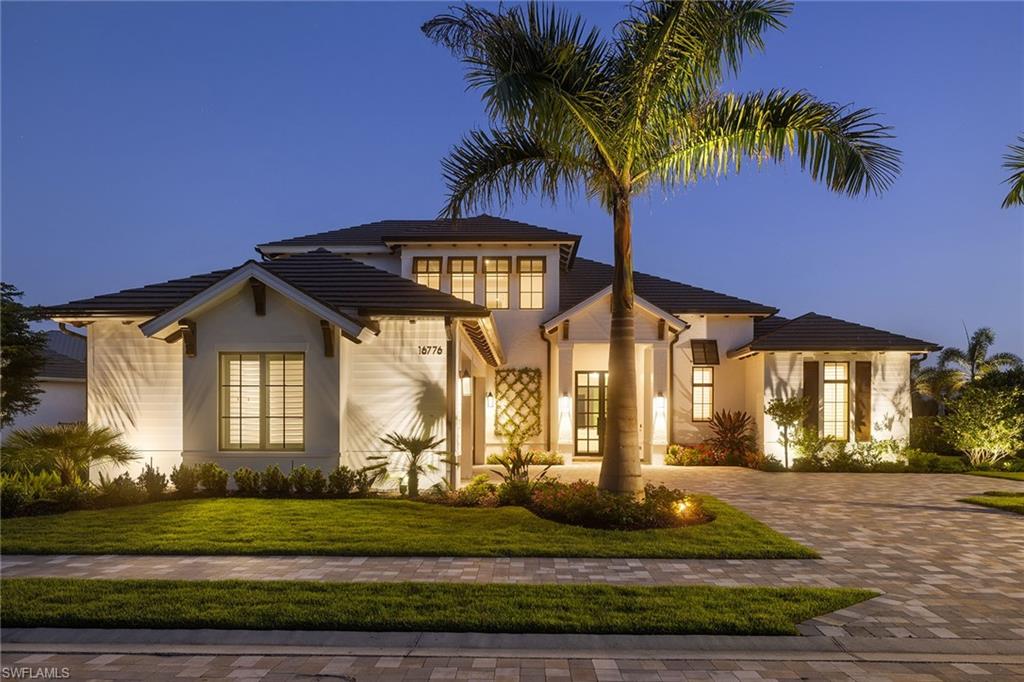 In the heart of Naples, where sunlight lingers a little longer and coastal breezes carry a quiet kind of luxury, a new home has emerged—not just as a residence, but as a statement. Completed in 2024, it rests on nearly one-half acre within a private, gated community. From the curb, it is clear this is no ordinary offering. Behind 10-foot, impact-rated iron double doors, a refined world unfolds.  The journey begins with light. Vaulted ceilings and wide-plank European oak floors set the stage for interiors curated with intention. Furnished with pieces from Arhaus and Restoration Hardware, layered with Ritz Carlton bedding, and framed by wood plantation shutters, every room balances elegance and comfort. Custom tile, hand-selected lighting and architectural quietude define the tone.  At the heart of the home, the chef’s kitchen, served by natural gas, impresses with Viking appliances, quartz countertops, a paneled island, oversized pantry and wine refrigerator. A 300-bottle wine storage wall invites evening rituals and thoughtful entertaining.  The primary suite is a retreat designed for restoration. Tray ceilings, dual walk-in closets and a spa-style bath—complete with a cast iron soaking tub and a frameless glass shower with both rain and wall-mounted heads—offer elevated serenity. The layout includes a private first-floor guest suite, two additional bedrooms upstairs, and flexible spaces including a loft and den, ideal for work or leisure.  Beyond the interiors, the home opens to a southern-facing outdoor living area designed for year-round enjoyment. A covered lanai with electronic screens, professional-grade Lynx grill and pizza oven create a seamless indoor-outdoor experience. The oversized pool and integrated spa embrace the sun’s path—ideal for afternoons on the sun shelf or tranquil evenings beneath Naples’ sunset skies.  Live intelligently with integrated smart-home technology, a Sonos sound system, impact-rated windows and doors, a tankless water heater, and energy-efficient systems. The three-car garage and professionally landscaped yard, supported by full irrigation, complete the home’s thoughtful design.  Offered fully furnished, with more than $400,000 in upgrades and inclusions, this residence is not just a place to live. It is a home that reflects a life well considered—where luxury is felt in the quiet rhythm of open space and the assurance of timeless detail. Centrally located near white sand beaches, world-class shopping, fine dining and the international airport. Here, luxury is felt in the quiet rhythm of open space and the assurance of timeless detail.Welcome to what’s next!