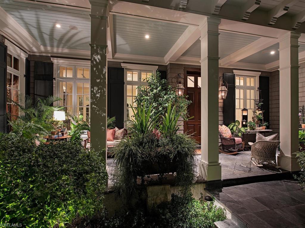 H.15016- Romantic, enchanting story-book home! Privately sited amidst lush tropical foliage on a .52 acre 114’ x 193’ lot. Elegant, unique & just steps from the Gulf, via beach walkway across the street. Inviting front porch of a bygone era w/gas coach lights welcomes you. Gorgeous, white oak floors flow throughout. Soaring ceilings, extensive custom millwork, fireplaces, 6-bedroom suites, tasteful tile work. Multiple studies, gourmet kitchen w/walk-in pantry, SubZero, Wolfe gas range, wine fridge, 2 lg. soapstone islands, open to spacious family room. French doors lead to versatile lanai w/summer kitchen, fireplace, retractable screens and shutters, ideal for year 'round outdoor enjoyment. This 9,047 Sq.Ft. residence boasts classic architecture reminiscent of a grand home in the Hamptons. Designed by esteemed John Cooney, built in 2016 to exacting standards, every element of the  was carefully chosen for its quality, character, and beauty, resulting in an exquisite blend of the finest fixtures & finishes. Storage galore! Luxurious master suite,meditation room, serene pool/spa area w/cascading water, fire pit. Gated w/ 3-bay garage, & generator. See Exceptional Features List.