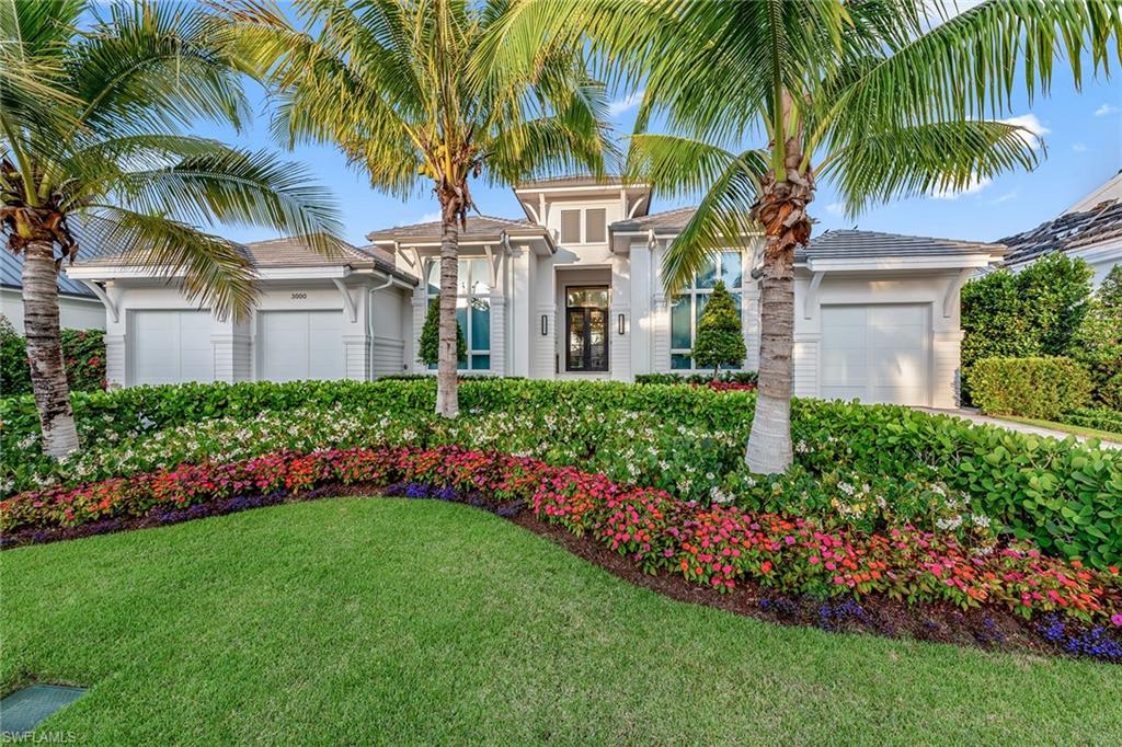 Welcome to coastal elegance at its finest. This stunning new home, completed in 2022 by distinguished Borelli Luxury Homes, has been meticulously designed and crafted, offering an unparalleled blend of sophistication and comfort. Every detail of this residence has been carefully selected by Jett & Company Interior Design, with high-quality furnishings, curated artwork, and accessories that complement the coastal-chic aesthetic. Step inside, and the grand foyer will make an instant first impression, while the expansive great room creates a refined yet inviting environment with its backlit feature wall and stunning ceiling details. The gourmet kitchen is a chef's dream, with its luxurious finishes, a full suite of Sub-Zero and Wolf appliances with gas cooking, an exquisite bar, a walk-in service pantry, plus more. The expansive owner’s suite is a relaxing haven showcasing an opulent bedroom, two walk-in closets with custom built-ins, and a spa-like bath with marble finishes and dual water closets, while the three beautifully appointed guest bedrooms and study each feature ensuite baths and bespoke finishes. Entertainment and relaxation abound out back, where a sparkling pool and spa set the perfect backdrop for the home’s beautiful covered lanai featuring an outdoor fireplace, full summer kitchen, and gas firepit adjacent to the pool. Enjoy a short walk to the beach for famed Naples sunsets or available access to the private Moorings Beach Park. This home truly represents the pinnacle of coastal living.