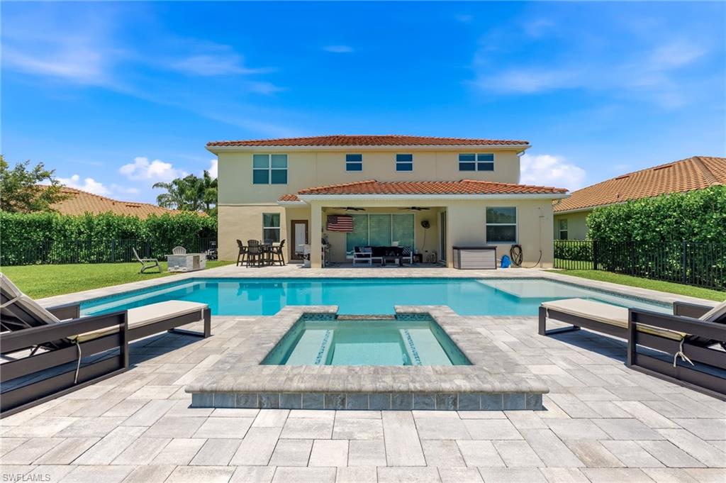 This one is a standout!  Completely remodeled and designed for modern living, this spacious residence offers 5 large bedrooms, a large loft including living space and den space—providing exceptional flexibility for work, guests, or multi-generational living. Two primary suites—one on each level—add rare versatility, complemented by an additional ensuite bedroom plus two more bedrooms and a fully updated bath upstairs.  Every bathroom has been elevated with marble countertops and custom cabinetry, delivering a clean, refined finish throughout. The kitchen is the true centerpiece—anchored by an impressive 9’ x 5’ waterfall island featuring dual charging stations, extensive storage, and seamless flow for entertaining. Premium LG WiFi-enabled appliances bring smart convenience into everyday life, including a refrigerator that lets you check inside without opening the door and a range complete with a pot filler for effortless cooking.  Outdoor living is just as impressive. Set on a generously sized lot with a large backyard and private canal gate access—perfect for fishing enthusiasts—this home is built for both relaxation and recreation. Enjoy the pool, dine in your outdoor kitchen, and rinse off in the outdoor shower before heading back inside.  Practicality meets lifestyle with a 2-car garage plus a separate 1-car garage, along with dual driveways offering abundant parking for guests, or extra vehicles.  Located in one of the county’s fastest-growing corridors, everyday convenience is right around the corner with shopping and restaurants now within walking distance.
Residents of The Groves enjoy a beautiful, amenity-rich setting with sparkling lakes, a resort-style pool, community center, and sport courts. In addition, homeowners also have access to the amenities at The Ranch at Orange Blossom, including fitness facilities, multiple pools, a kiddie pool, and basketball courts.
Families will appreciate the proximity to three highly regarded Collier County schools just minutes away. With Immokalee Road only 5 minutes out, commuting across Naples is simple—whether heading to white sand beaches, upscale dining, or world-class shopping.  And with the new Big Corkscrew Regional Park less than 10 minutes away, recreation opportunities—from sports fields to outdoor activities are right at your fingertips.  A rare combination of space, upgrades, location and lifestyle - This home offers it all.