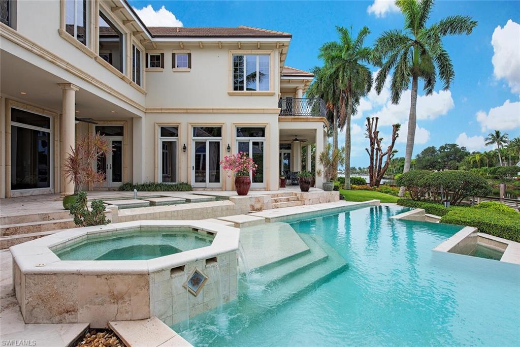 Boaters paradise! Custom Port Royal estate home with 137ft. of water frontage with western exposure, enjoy the sunsets. This well maintained property is perfect for entertaining with multiple outdoor living areas and an open floor plan, lanai, and custom infinity edge pool and spa.  Ceilings heights soar to 22 ft, wood beams, and extensive millwork.  This desirable waterfront property comes with a  large 85ft. dock, and  boat lift with direct access to the Gulf of Mexico.  Ideally located in prestigious Port Royal in just minutes from 3rd Street South’s and 5th Avenue South's fine dining, world-class shopping and white-sand beaches.  Port Royal Club membership eligibility.