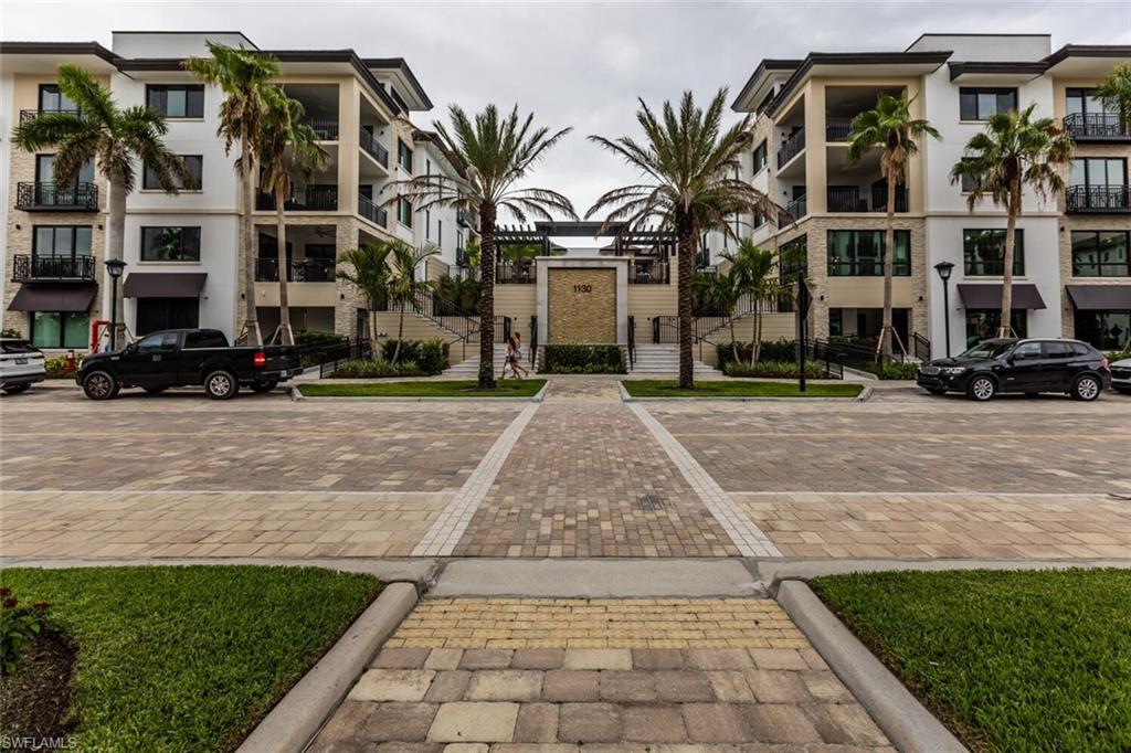 Introducing a stunning 3 bed, 3.5 bath designer furnished gem in the prestigious Quattro building at Naples Square. This luxurious model residence offers a captivating blend of elegance & style. An open layout with high-end finishes & impeccable attention to detail. The spacious living area, bathed in natural light, creates an inviting ambiance to relax or entertain guests. The chef's kitchen boasts top-of-the-line appliances, Wolf, Sub-Zero, and Miele. Upgraded cabinetry, custom range hood, and stylish waterfall island for culinary delights. Retreat to the primary en-suite bedroom, complete with spa-like bath, walk-in shower, and two walk-in closets. 2 more well-appointed en-bedrooms & den offer comfort and flexibility. Views from the private balcony, are perfect for savoring the warm Florida winters. Resort-style amenities are a pool, hot tub, covered TV bar, grill, fitness room & chic social room. Features lower-density living, 2 parking spaces & climate-controlled storage space. With convenient access to the vibrant Naples downtown, renowned dining, shops & white sand beaches & the up-and-coming designed district. A Naples Square masterpiece that combines luxury & convenience.