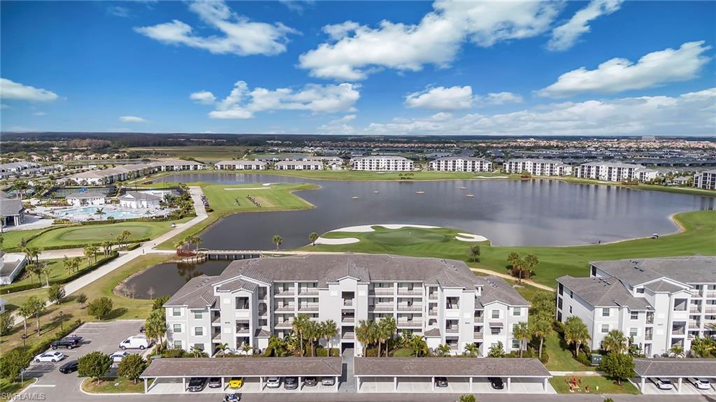 This 2 BR condo at the National Golf and Country Club is located in the fastest growing community in SW Florida, Ave Maria. This is a 1st floor condo that includes a covered carport space in front of the unit, amazing resort amenities including a resort style pool, pool side tiki bar, club restaurant, numerous pickle ball courts, a state-of-the art fitness center and much much more. This is a gated community with a 24/7 manned guard booth. Resort style living will make this your trye paradise; your year-round home or home away from home. Call for a private showing today. You won't be disappointed!