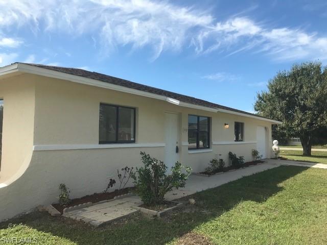 Affordable home located on an oversized lot in Lehigh Acres with central water & sewer.  New A/C system was installed in 2018.  Tile throughout, laundry located in the garage.  This home is centrally located within walking distance to shopping, restaurants.  Close to schools and parks. Agents please read confidential comments
