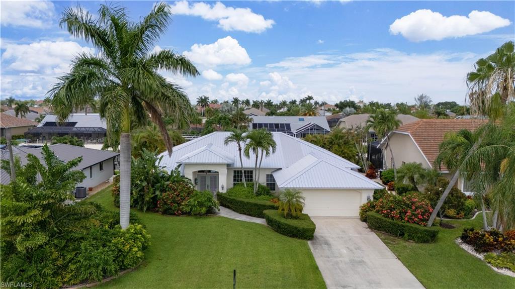 Welcome to one of Southwest Florida's most sought-after waterfront neighborhoods, where luxury living meets unmatched boating convenience. This impeccably maintained 3-bedroom + den, 2-bath residence offers over 2,000 square feet of thoughtfully designed living space and direct sailboat access to the Gulf of Mexico, placing world-class fishing, boating, and waterfront dining less than 20 minutes from your dock. From the moment you arrive, you'll appreciate the home's exceptional curb appeal, highlighted by meticulous tropical landscaping and undeniable pride of ownership. Inside, the home is spotless and beautifully cared for, offering spacious living areas, abundant natural light, and a functional layout designed for both everyday living and entertaining. Built to last, the durable metal roof provides long-term peace of mind, while the home's outstanding condition reflects years of attentive maintenance and care. Whether you're relaxing indoors, entertaining guests, or heading out for a sunset cruise, this property delivers the ultimate Florida lifestyle. Rarely does a home combine premium waterfront access, exceptional maintenance, and an unbeatable location so seamlessly. Don't miss this opportunity to own your piece of paradise in one of Southwest Florida's premier boating neighborhoods.