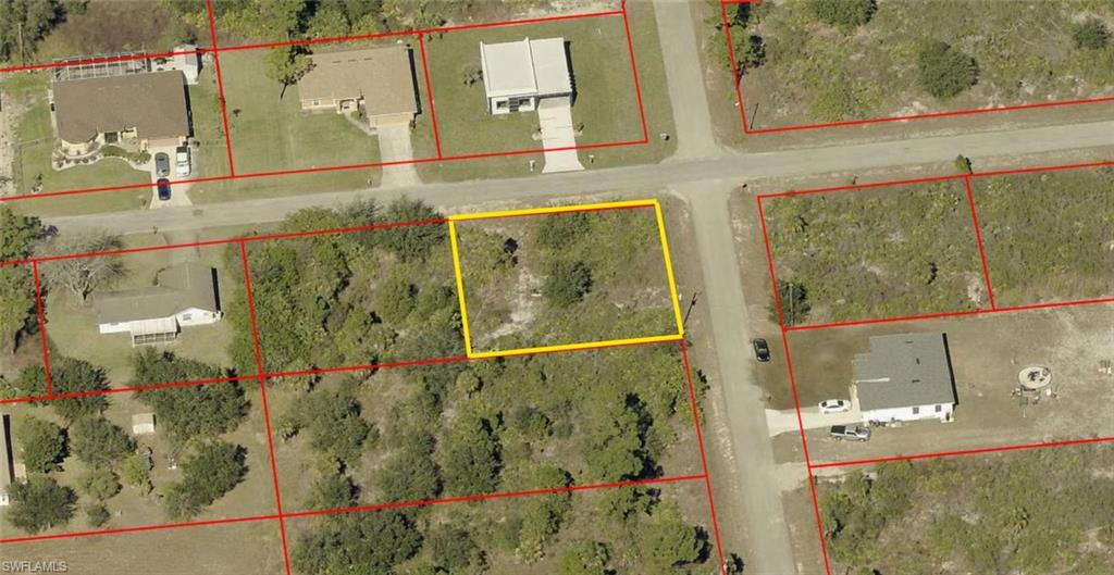 Escape the hustle and bustle with this exceptional 1/4-acre residential homesite nestled in a quiet, rural pocket of Lehigh Acres! Positioned perfectly as a highly desirable corner lot, this property offers incredible versatility for your future custom build. The corner configuration provides distinct advantages over traditional interior lots, including enhanced curb appeal, dual-street access for a side-load garage or boat/RV parking, and added distance from neighboring homes for maximum privacy.  Building here is made easy with power lines already running directly along the street, and high-speed internet is available to keep you fully connected. Best of all, this lot is situated outside of a designated flood zone (Zone X), saving you thousands annually on mandatory flood insurance premiums.  Enjoy the peace and tranquility of a quiet neighborhood while remaining just a short drive from local shopping, dining, and schools. Bring your builder and turn your dream home into a reality today!