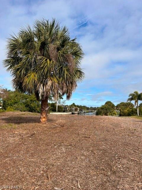 Dreaming of the perfect waterfront getaway? Look no further! This prime Port Charlotte lot is your golden ticket for building the home you'vealways wanted. Picture this: a private seawall, your very own boat dock and lift, and direct access to the beautiful waters right from yourbackyard. Whether you're into boating, fishing, or just soaking up the Florida sun, this spot has it all. Plus, the property already has power on-site, so you can dive straight into construction without any delays. It’s a fantastic opportunity for builders, investors, or anyone eager to createtheir dream space. Nestled in a well-established waterfront neighborhood. So, why wait? Your dream home is just a blueprint away—make it areality in this sunny slice of paradise!