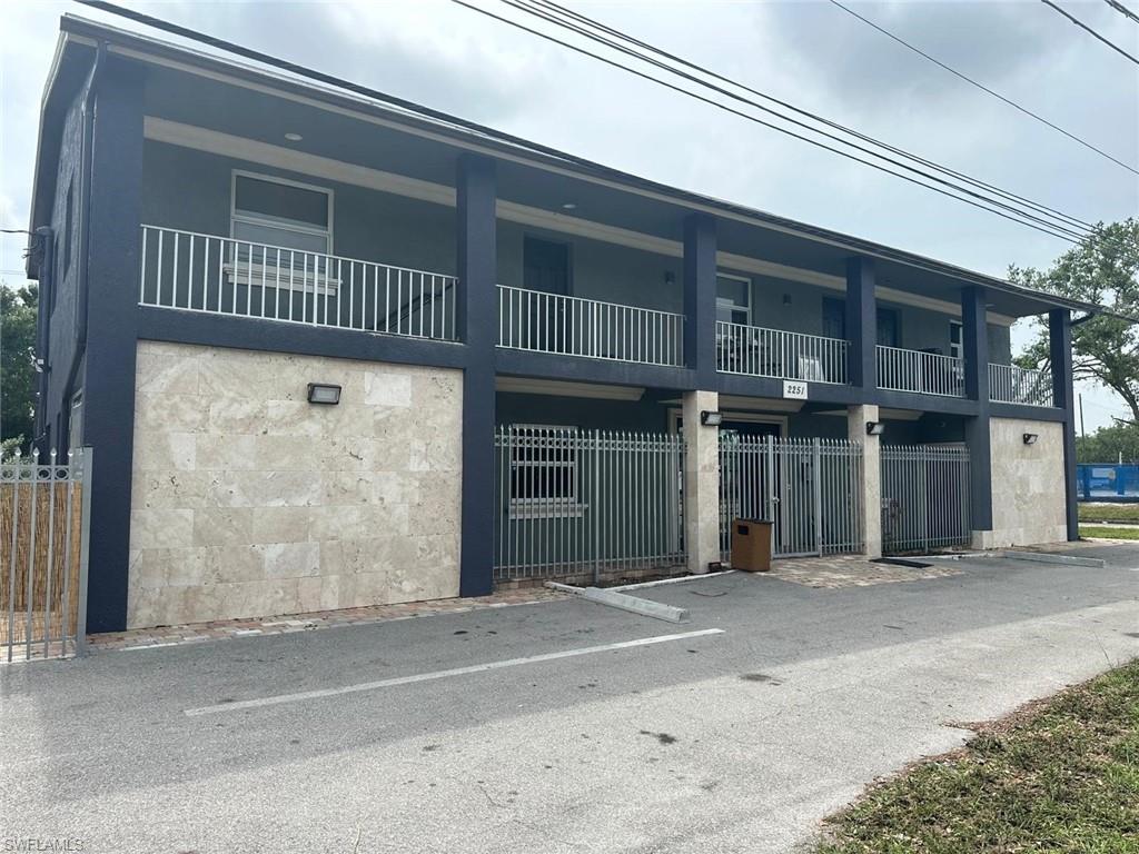 Positioned in the heart of rapidly revitalizing Downtown Fort Myers, this unique mixed-use property offers exceptional income and redevelopment potential in one of Southwest Florida's most dynamic growth corridors. Conveniently located directly adjacent to the renowned Fort Myers Skatium, a popular destination featuring an ice skating arena, athletic gymnasium, and fitness center, the property benefits from consistent traffic and strong community presence. Adjacent property 2109 Crawford included with sale for $1,490,000.

The building features three distinct income-producing spaces. Upstairs, you'll find two beautifully renovated residential condominium units, including a spacious 3-bedroom, 2-bath open-concept residence and a well-appointed 2-bedroom, 2-bath unit. Both offer modern finishes and comfortable living accommodations in a highly desirable downtown setting.

The ground floor is currently configured as a music studio, providing flexible commercial space suitable for creative professionals, retail, office, wellness, or specialty business use. A fully fenced parking lot with approximately 10 dedicated parking spaces adds significant value, offering convenience, security, and ample parking for tenants, customers, and guests.
Downtown Fort Myers is undergoing a remarkable transformation, with luxury residential developments, expanded hospitality offerings, and major infrastructure investments reshaping the city's skyline and fueling economic growth. This property presents an outstanding opportunity for investors, owner-users, or developers seeking a foothold in one of Florida's most exciting urban markets.
Don't miss the chance to own a versatile mixed-use asset in a thriving downtown location with endless possibilities.