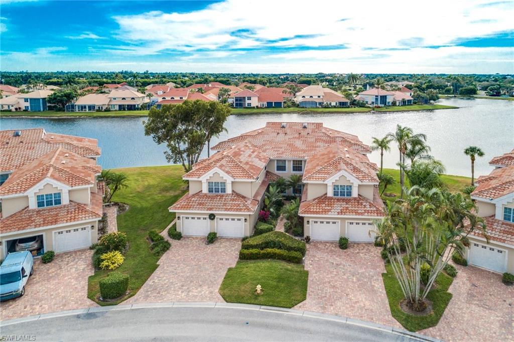 Incredible lake views from this light & bright first floor coach home located in Spinnaker Point at Windstar on Naples Bay! This popular floor plan offers a spacious kitchen with granite counters and center island, crown molding, plantation shutters, large laundry room with storage closet and spacious lanai with new frame and screens. Additional features include: Attached garage, new roof, new garage door and paver brick driveway. Spinnaker Point offers great curb appeal, large heated community pool/spa/clubhouse, private tennis courts, tropical landscaping and much more.                    
Windstar offers incredible amenities including: Tom Fazio designed golf course, clubhouse with spectacular views of Naples Bay, 72 slip deep-water marina with direct Gulf access in less than ten minutes, clay tennis courts, fitness center, Keewaydin Island Beach Club with boat shuttle and private membership.