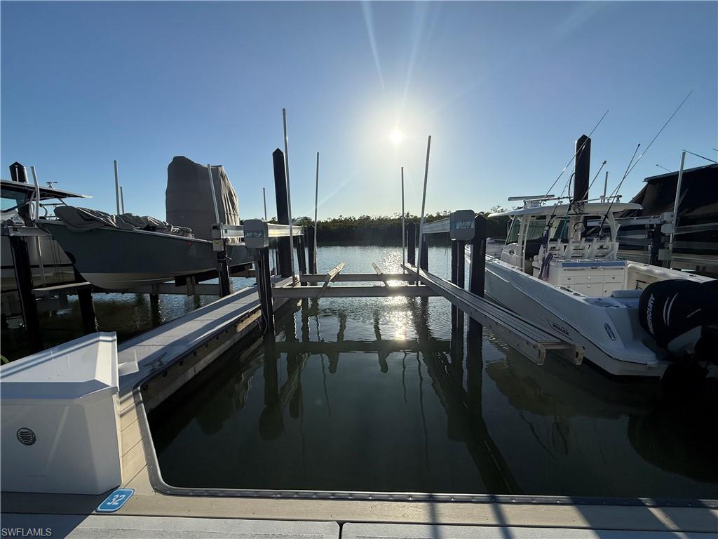 ISLAND MARINA - Wet Slip 32 measures 44'L x 15'W w/a 16k Lbs. Boat Lift. Complemented by a fully renovated marina (2025) with new concrete floating docks, pilings, electrical/water, security cameras, WIFI access to all slips and gated access. Slip 32 is just a few steps from vehicle parking, making it easy for loading and unloading of your gear. Direct Gulf access from Wiggins Pass with No Bridges. The quarterly fee covers taxes, dock maintenance, water and restrooms. Highly desirable North Naples location off Wiggins Pass Road.