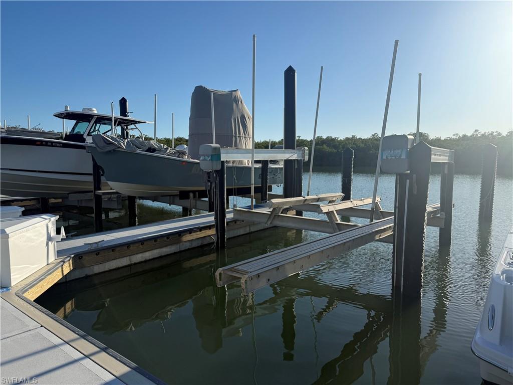 ISLAND MARINA - Wet Slip 32 measures 44'L x 15'W w/a 16k Lbs. Boat Lift. Complemented by a fully renovated marina (2025) with new concrete floating docks, pilings, electrical/water, security cameras, WIFI access to all slips and gated access. Slip 32 is just a few steps from vehicle parking, making it easy for loading and unloading of your gear. Direct Gulf access from Wiggins Pass with No Bridges. The quarterly fee covers taxes, dock maintenance, water and restrooms. Highly desirable North Naples location off Wiggins Pass Road.
