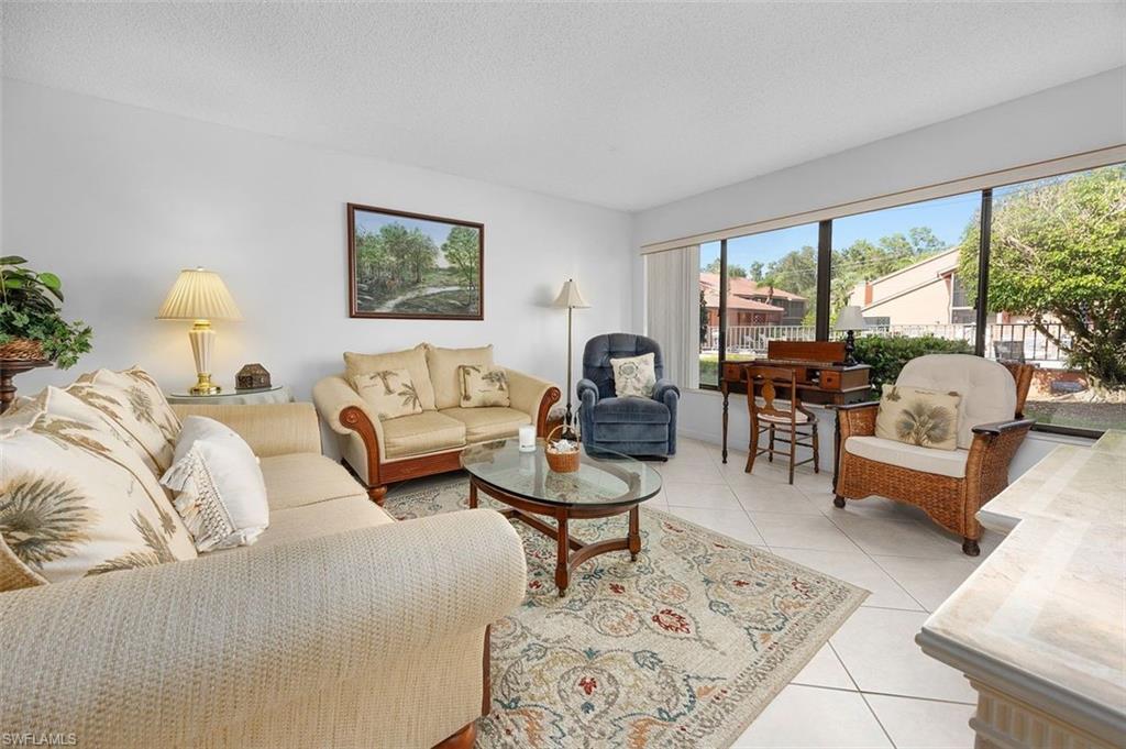 One or more photo(s) has been virtually staged, AI generated or rendered.  Fantastic North Naples location. The perfect vacation condo at an outstanding price point.  2 bedroom 2 bath condo with covered parking. This first floor condo is bright and roomy.  Cozy dining area and bar top for ample seating. Primary bedroom has ample space for a king sized bed. Kitchen is stocked with newer appliances. The unit is close to the community pool. A quick 10 minutes from the beach! This community is located off the Immokalee Road corridor with access to everything you need to live the fabulous Naples, Florida lifestyle. Located close to shopping, restaurants, hospitals, doctor's offices.