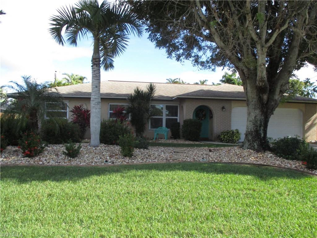 Wow, desirable SAVONA neighborhood.  So many upgrades in this saltwater, solar heated, POOL home..nearly $100K worth.  This home is perfect for outside entertaining and enjoyment.  The lanai runs the length of the house and features a HUGE pool, hot tub, summer kitchen, brick pavers, landscaping inside the lanai area, pool bath and outside storage.  Plus, there is plenty of room for seating, tables, etc. Kitchen has granite, stainless appliances, wood cabinets, modern lighting, and attractive back splash.  Home is tiled throughout. Bathrooms are updated.  The master bedroom sports a door to the lanai.  Roof, replumb, and kitchen were all done in 2013.  A/C was replaced in 2015.  Its really all done for you here.  Home sits across the street from 1 million $$ plus waterfront homes.  Enjoy the waterfront community without the waterfront prices.